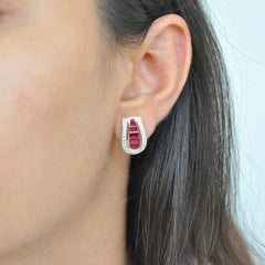 18 Karat Gold Calibre Cut Channel Set Burma Ruby Baguettes Diamond Stud Earrings
