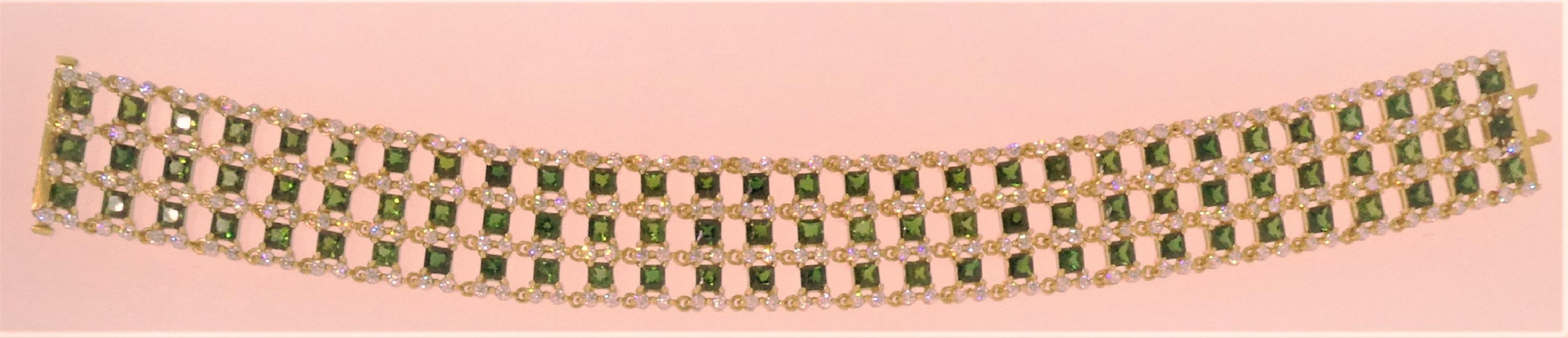 Creator and designer Michael Engelhardt brings you this light, airy, and lovely 18 Karat yellow gold mounting that weighs 41.39 grams.  The bracelet contains 87 beautifully matched Chrome Tourmaline Squares (15.50 carats) and 325 Diamonds (4.66