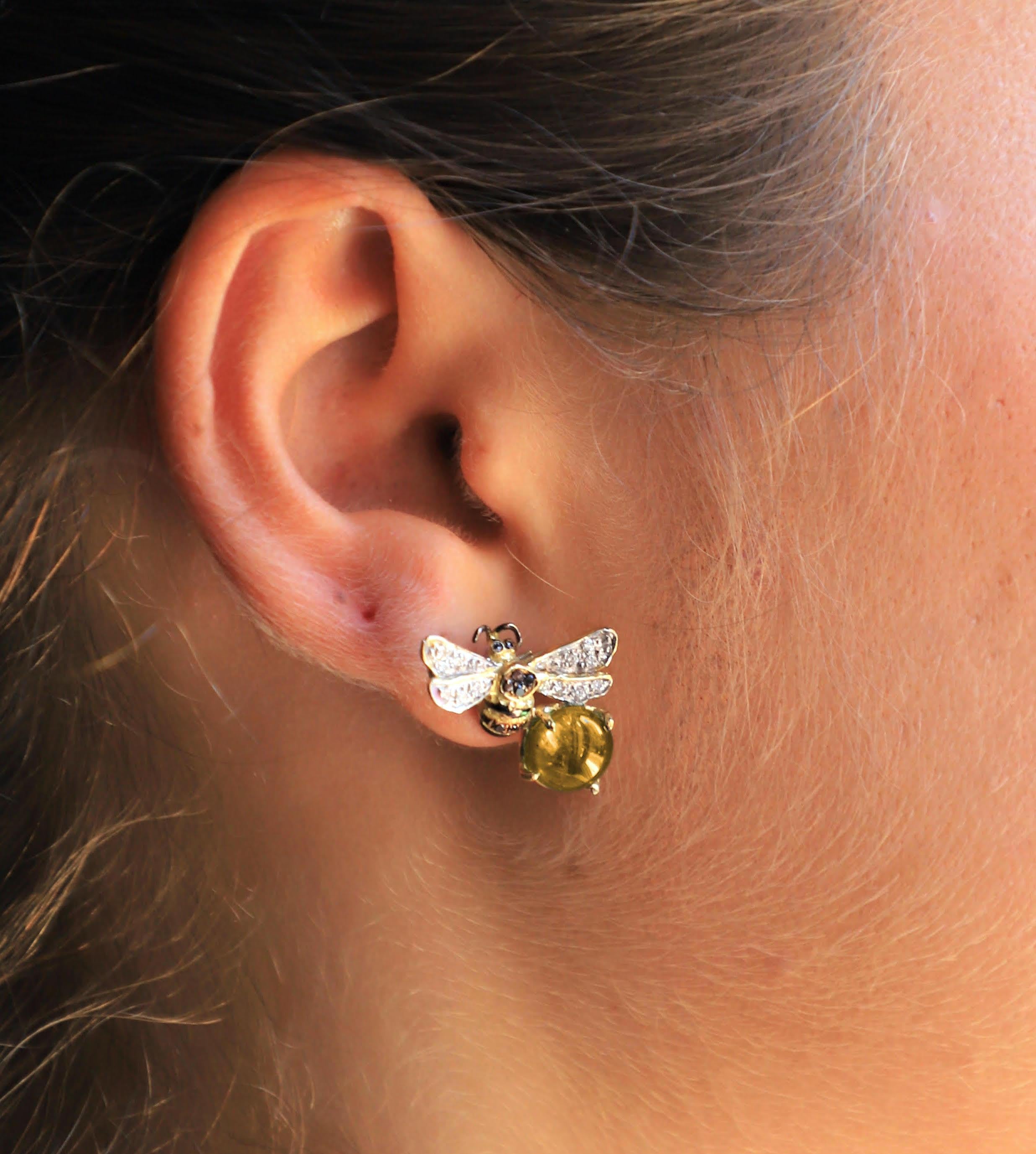 Rossella Ugolini Design Collection a pair of beautiful Bees Stud Earrings handcrafted in 18 Karats Yellow Gold and adorned with a Yellow Citrine and 0.16 Karats White Diamond 0.18 Karats Black Diamonds. The main actor of these earrings is a Bee