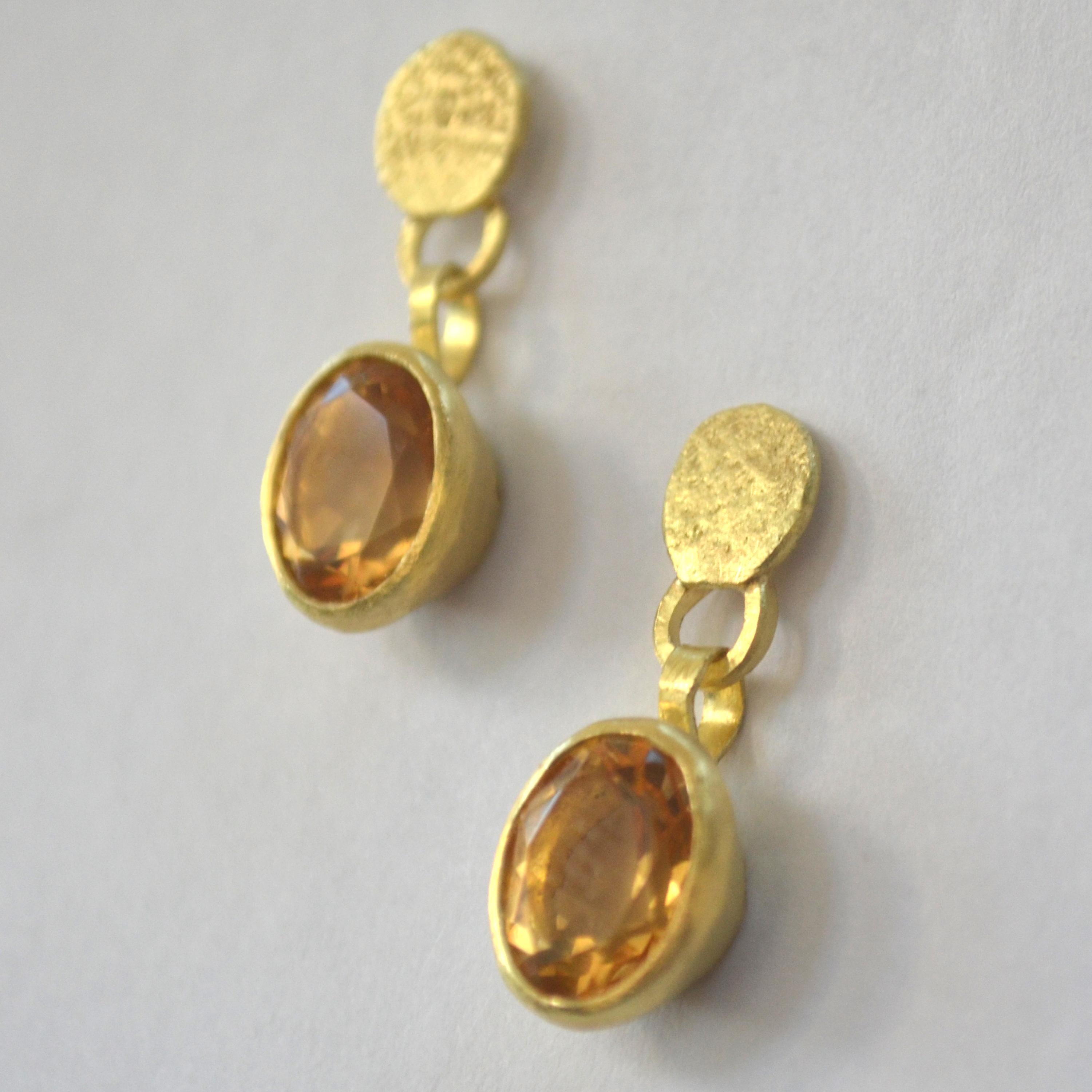 18k yellow gold melted disc stud earrings with citrine drops.

These earrings are handmade by London goldsmith Disa Allsopp. Using reticulation and forging techniques to create her jewellery, Disa is inspired by ancient civilisations and colours