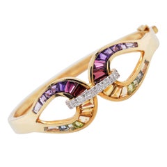 18 Karat Gold Channel Set Multi-Color Taper Baguette Diamond Rainbow Bracelet