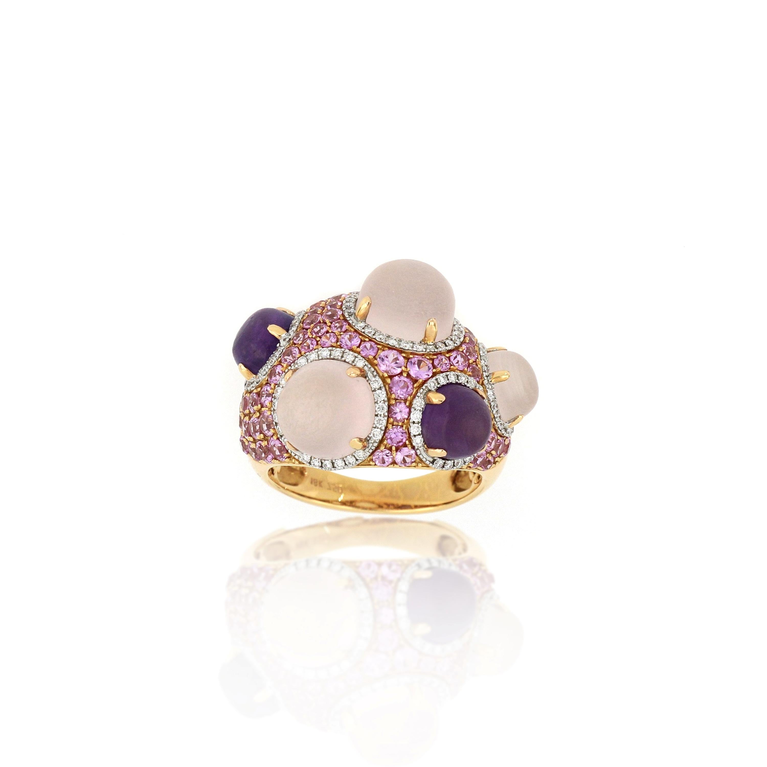 This large unique cocktail ring features 2 natural amethyst and 3 pink quartz, weighing 2.31ct and 6.72ct respectively, surmounted with pink sapphire (1.53ct)  and diamonds (0.33ct), mounted in 18 karat rose gold.

O’Che 1867 is renowned for its