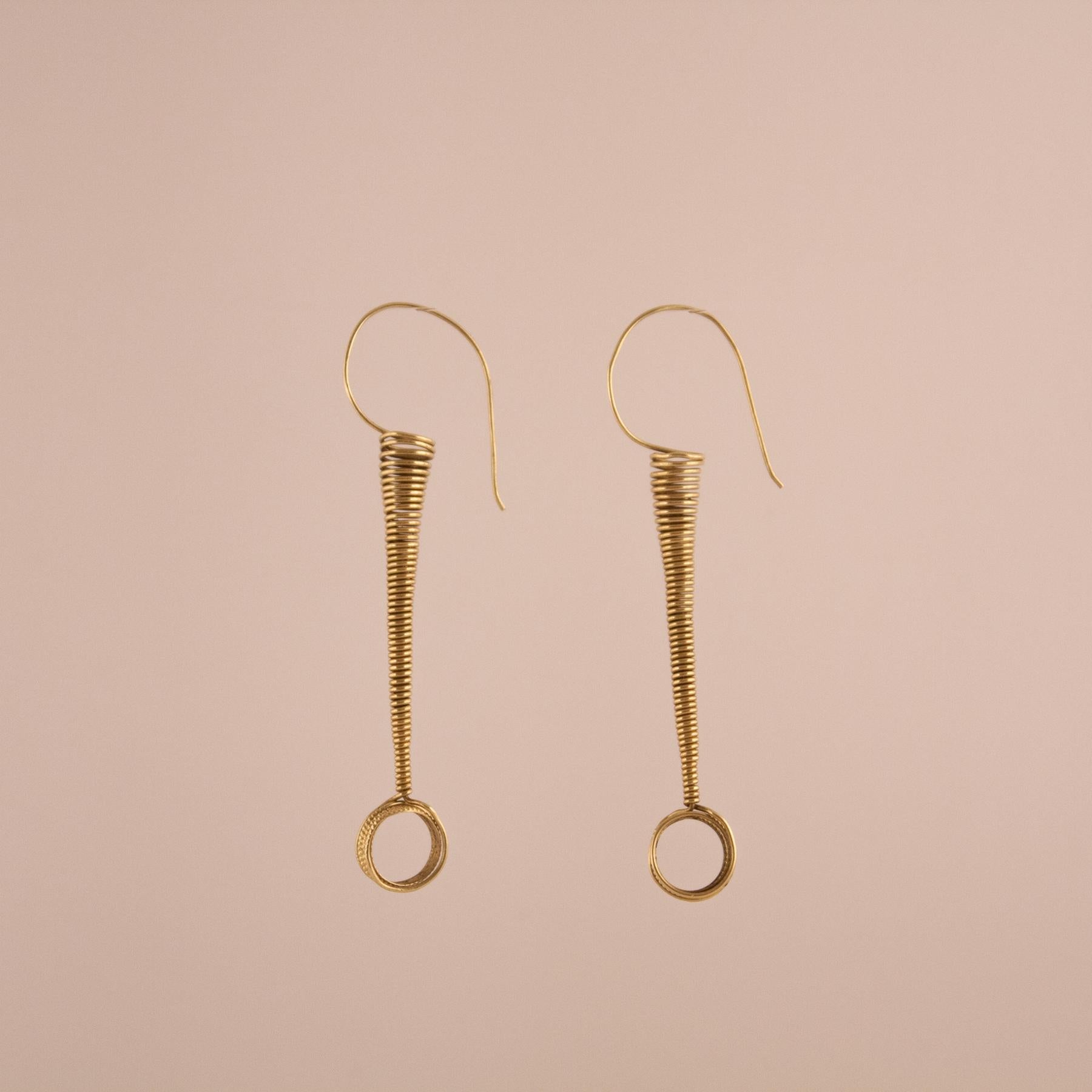 18 karat gold coil earrings from India, circa 1970. Lightweight, flexible and fun, these spring-like earrings are, at once, tribal and contemporary in appearance. 
Gold: 10.12 grams