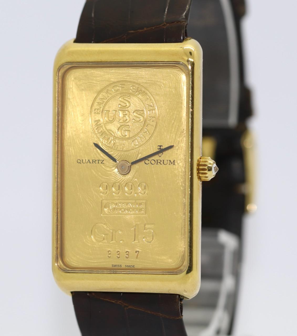 18 Karat Gold Corum Wrist Watch with Gr. 15 UBS SBG Gold Bar in 24K Ref. 4440056

18 Karat solid Gold Case 24 mm x 41 mm. 
Quartz movement.
Dial 24k solid fine Gold 15 gram.
Strap and clasp also original Corum.
Clasp Gold plated.

Including