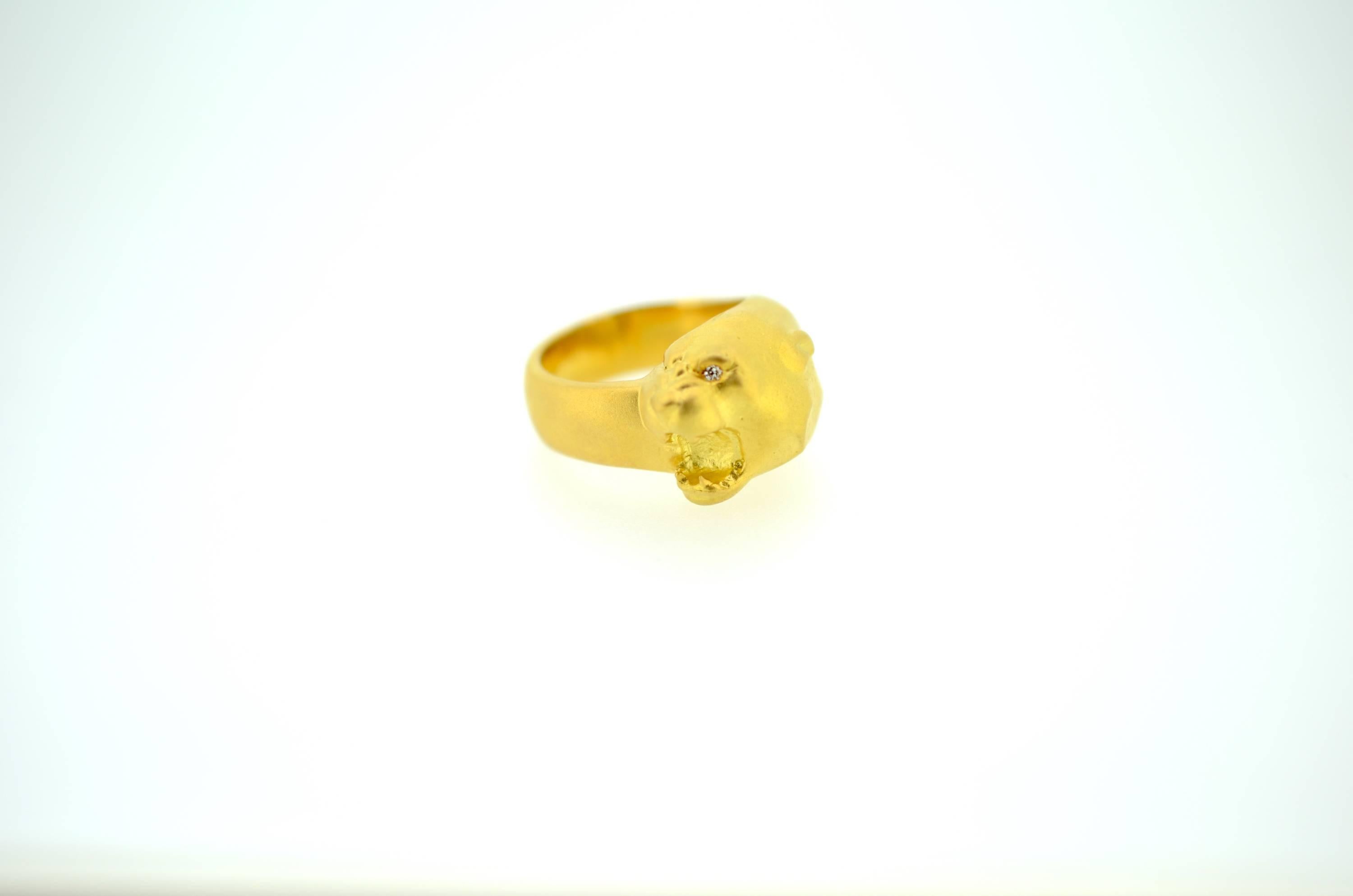 Hand carved full dimension cougar ring with diamond eye. Weighs 15 DWT. Carved in Lost Wax process.