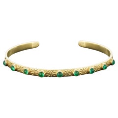 18 Karat Gold Cuff with 9 Cabochon Emeralds and Engraving of Stars & Moons