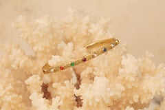 18 Karat Gold Cuff with 9 Cabochon Gems and Engraving of Star and Moons