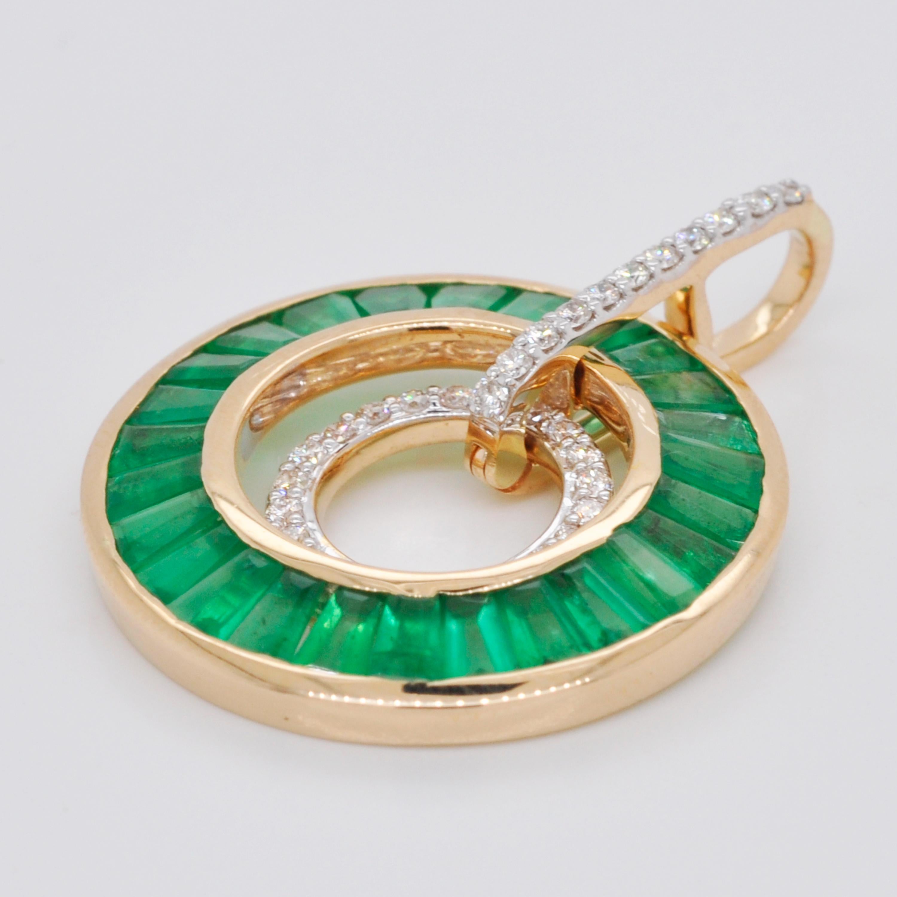 18 karat gold art-deco style tapered baguettes emerald diamond circular pendant.

This extraordinary art deco style delicate pendant featuring vivid lush green emeralds is encapsulating. Meticulous hand-picked selections of 26 lustrous Zambian