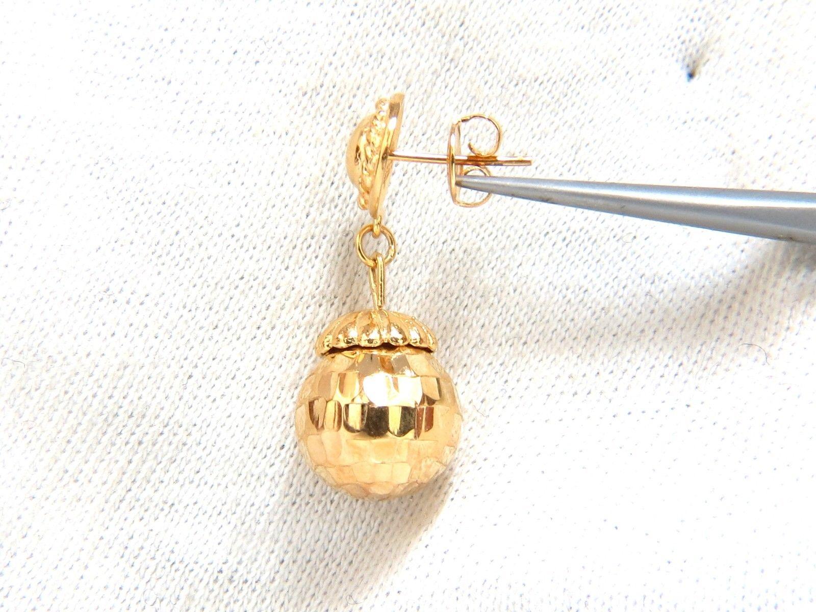Measurements of Earrings:Faceted Dangle Ball Earrings

12mm diameter ball

9mm circular top

29mm long

Comfortable Butterfly Pushbacks

6 grams / 18kt. Yellow Gold

Earrings are gorgeous made
