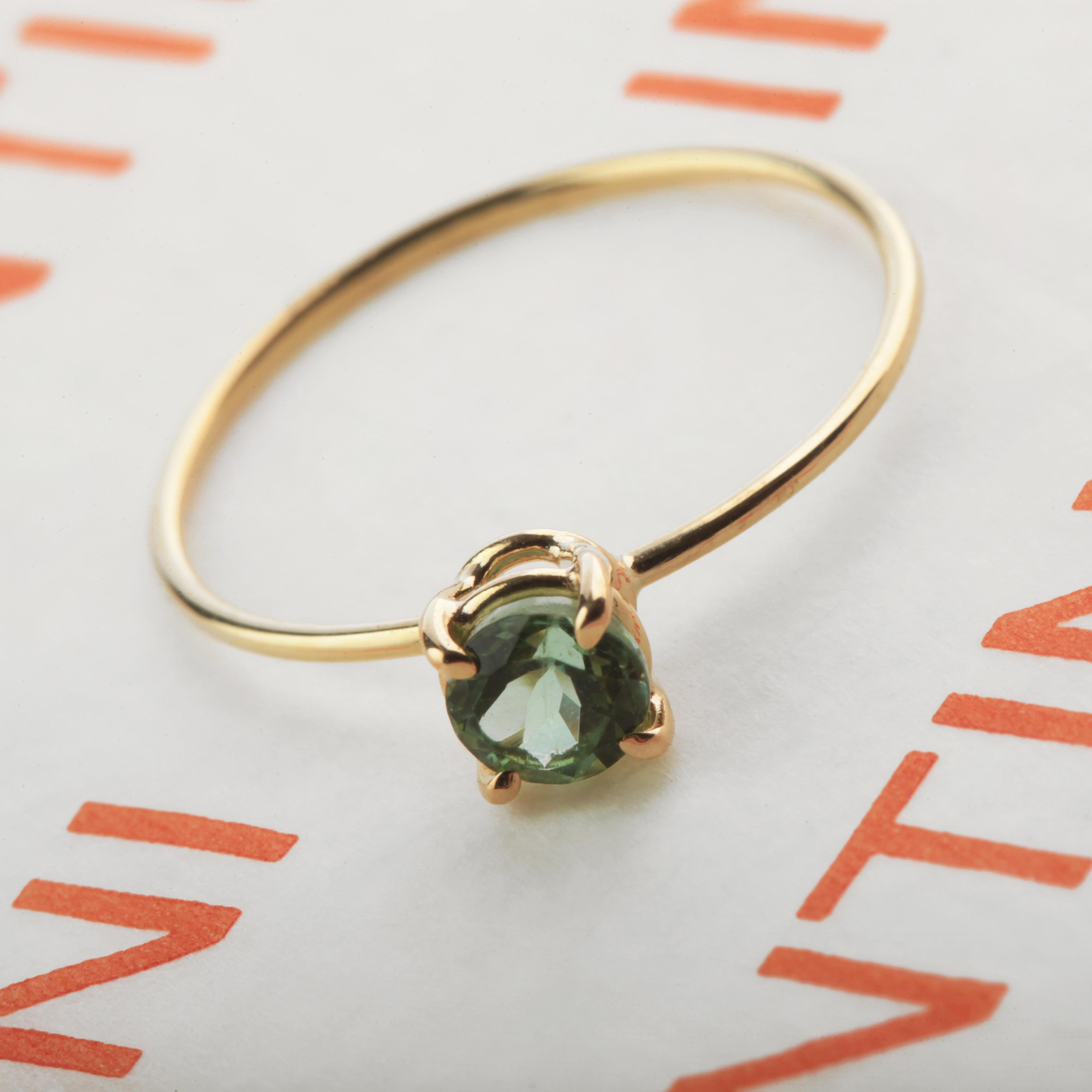 Signature INTINI Jewels green tourmaline jewellery. Modern and elegant ring design in 18k yellow gold with an brilliant cut with tiny griffes sormounting the ring.

Green Tourmaline is ideal for healing purposes, as it can focus its healing