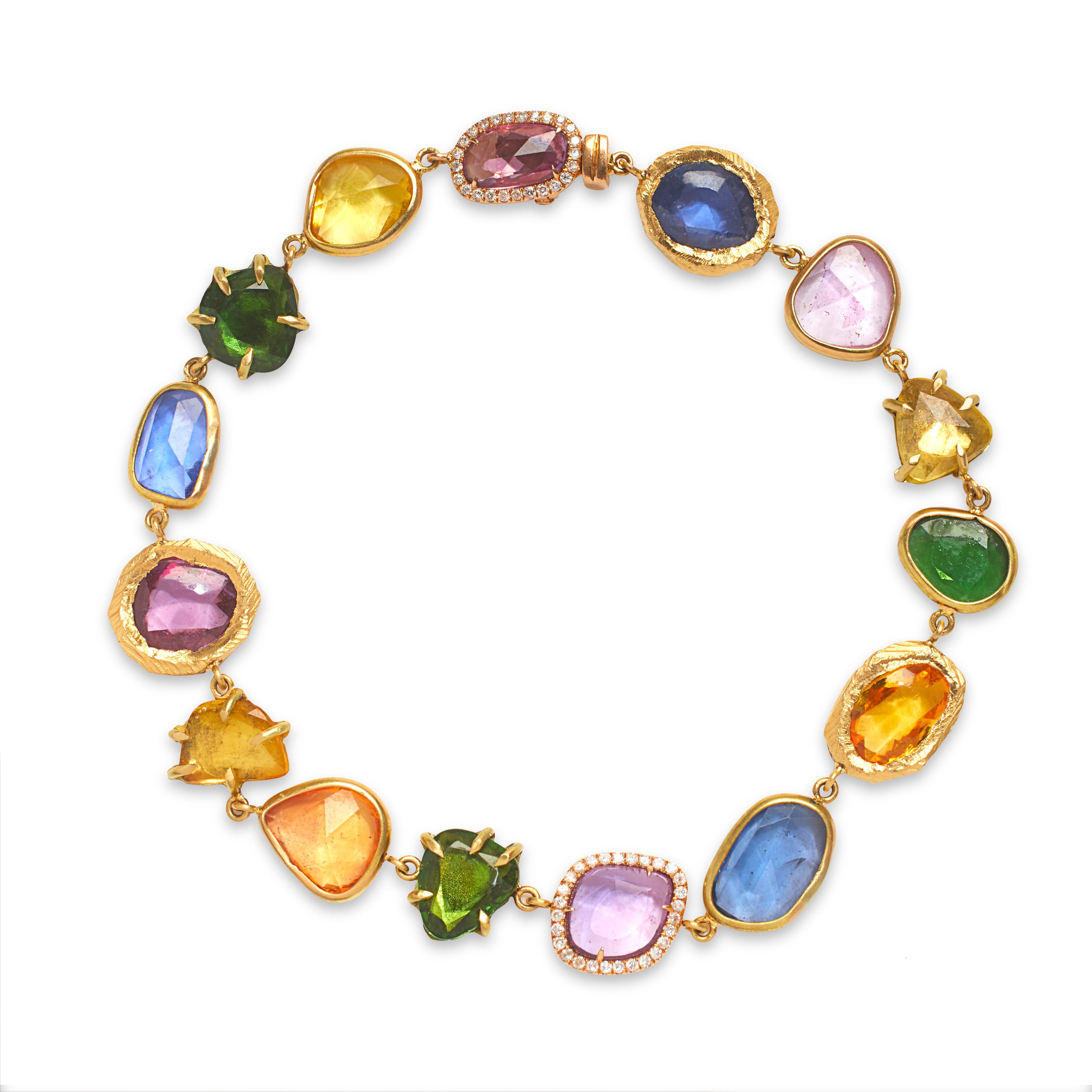 Handcarved 18KT Gold bracelet with multi-colored sapphires including diamonds, tsavorite garnets, blue sapphires, orange sapphires, and pink sapphires.  One-of-a-kind bracelet with 21.85 total carats weight (18.48 sapphires and 3.37 tsavorites). 