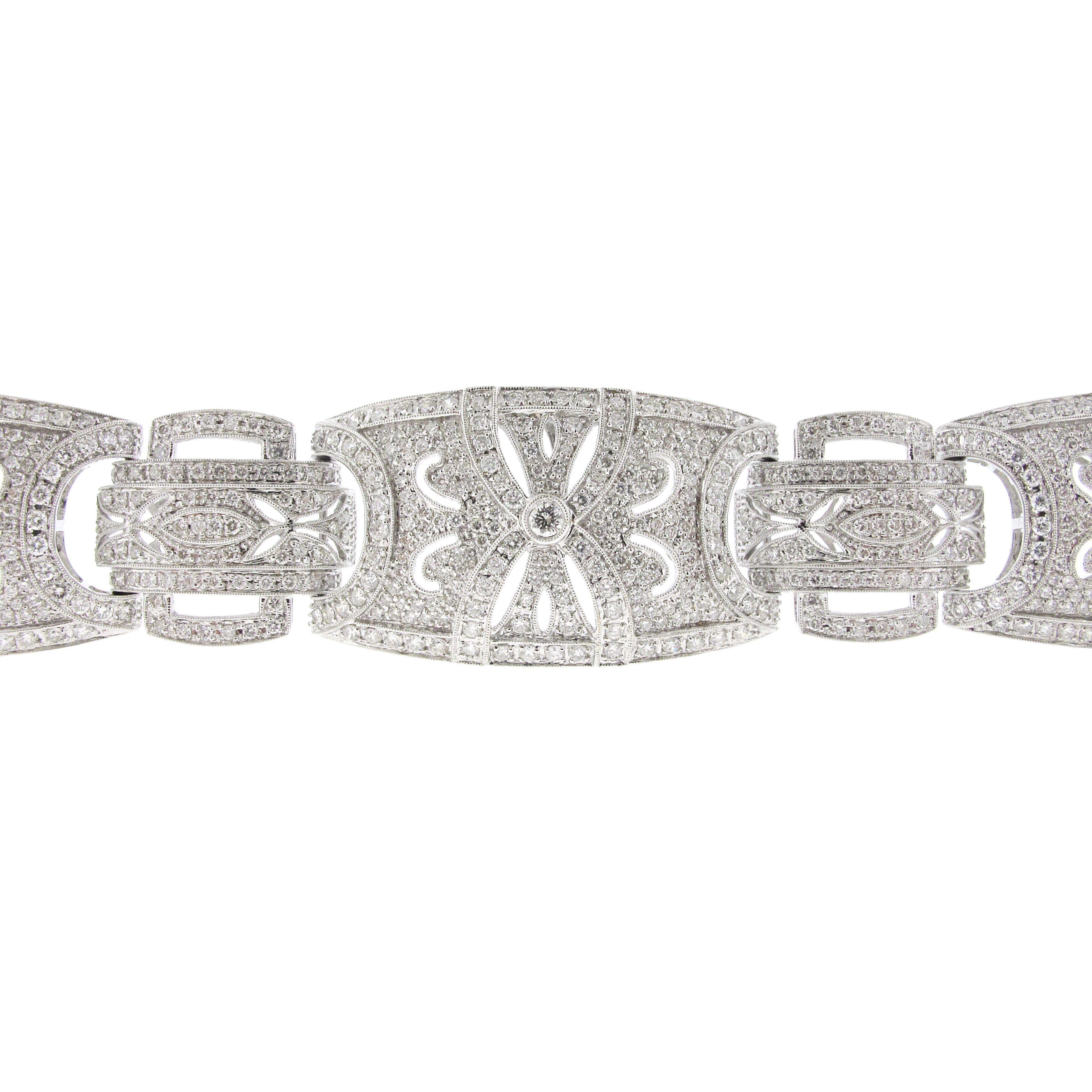 Modern style diamond bracelet made in 18 karat white gold. There is an estimated carat weight of 14.75. The diamonds are white in color and eye clean.
The bracelet allows for a big look without a big price. 
The bracelet was made in 18 karat white