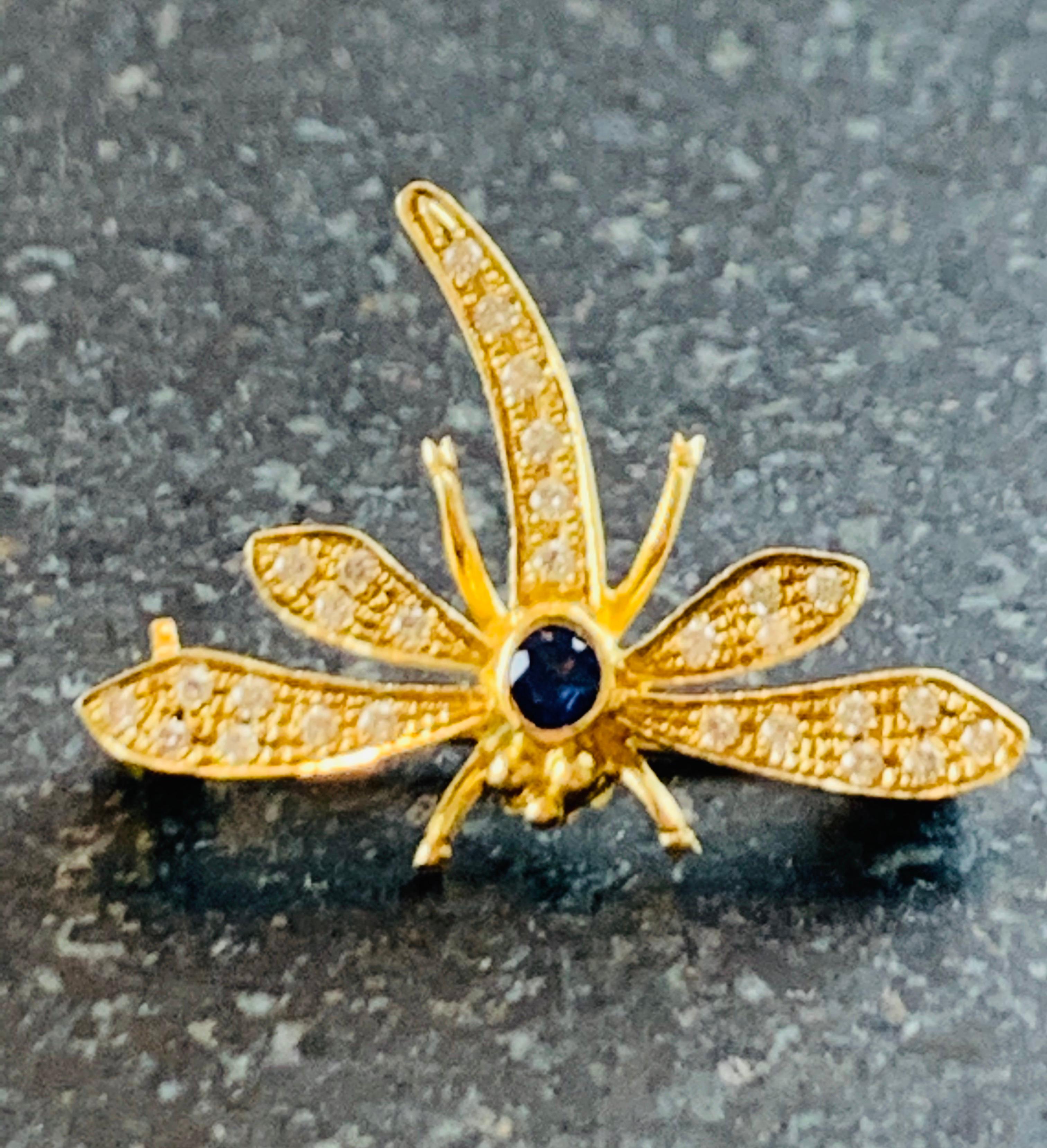 Charming Detailed 18 Karat Yellow Gold and Brilliant White Cut Diamond Dragonfly Booch With Blue Sapphire. Approximately 0.75ct diamonds. Gold Pin With Clasp On Rear Which Makes It Easy And Safe To Wear. A Wondefully Charming European Brooch. 