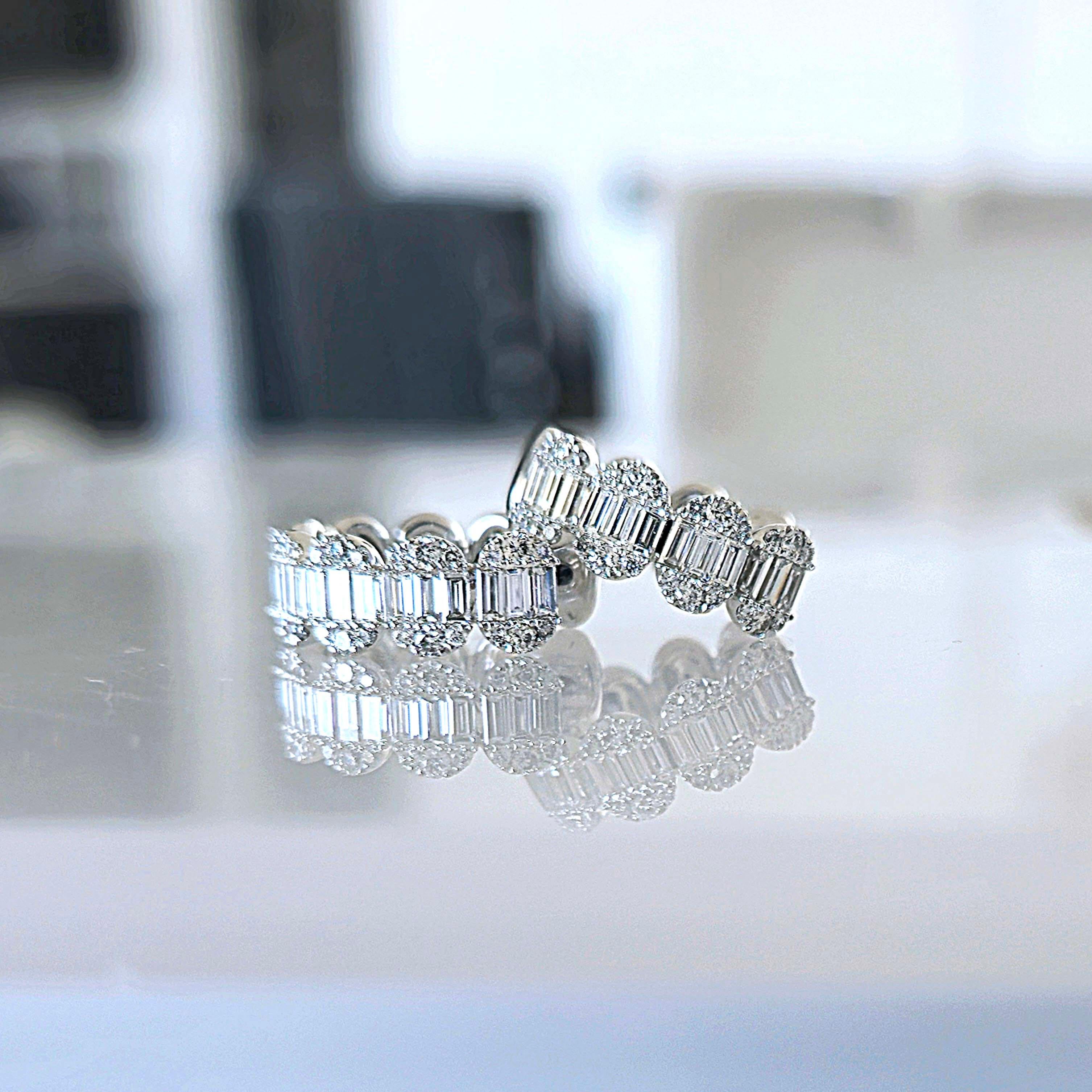 Produced by award winning Italian designer Stefano Vitolo. Stefano creates custom artisanal one of a kind jewelry with excellent gemstones in a truly old world Italian craftmanship.

Baguette diamonds: 0.67ct
Round diamonds: 0.32ct