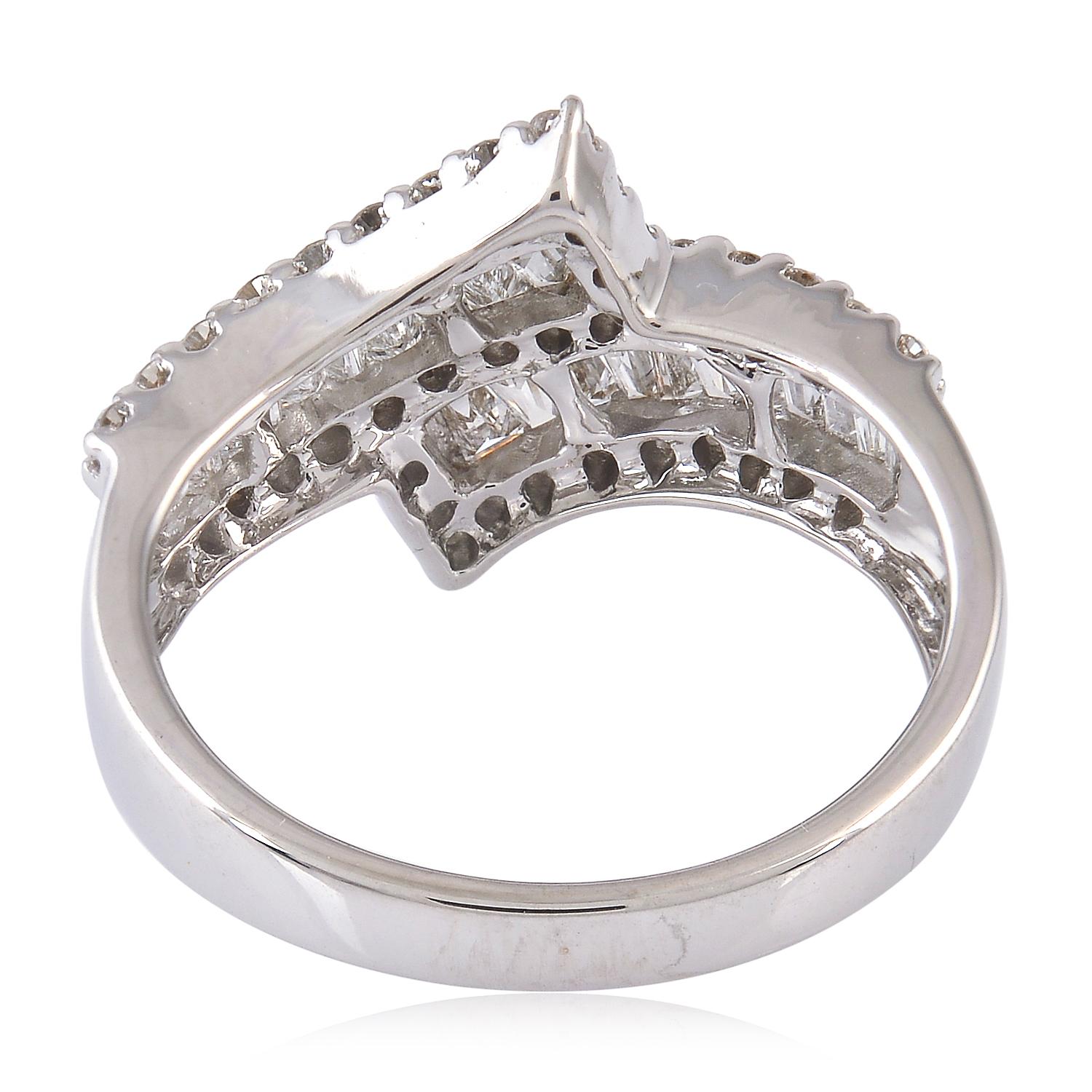This ring has been meticulously crafted from 18-karat white gold and set in .95 carats of sparkling diamonds. 

The ring is a size 7 and may be resized to larger or smaller upon request. Please note that carat weights may slightly vary as each