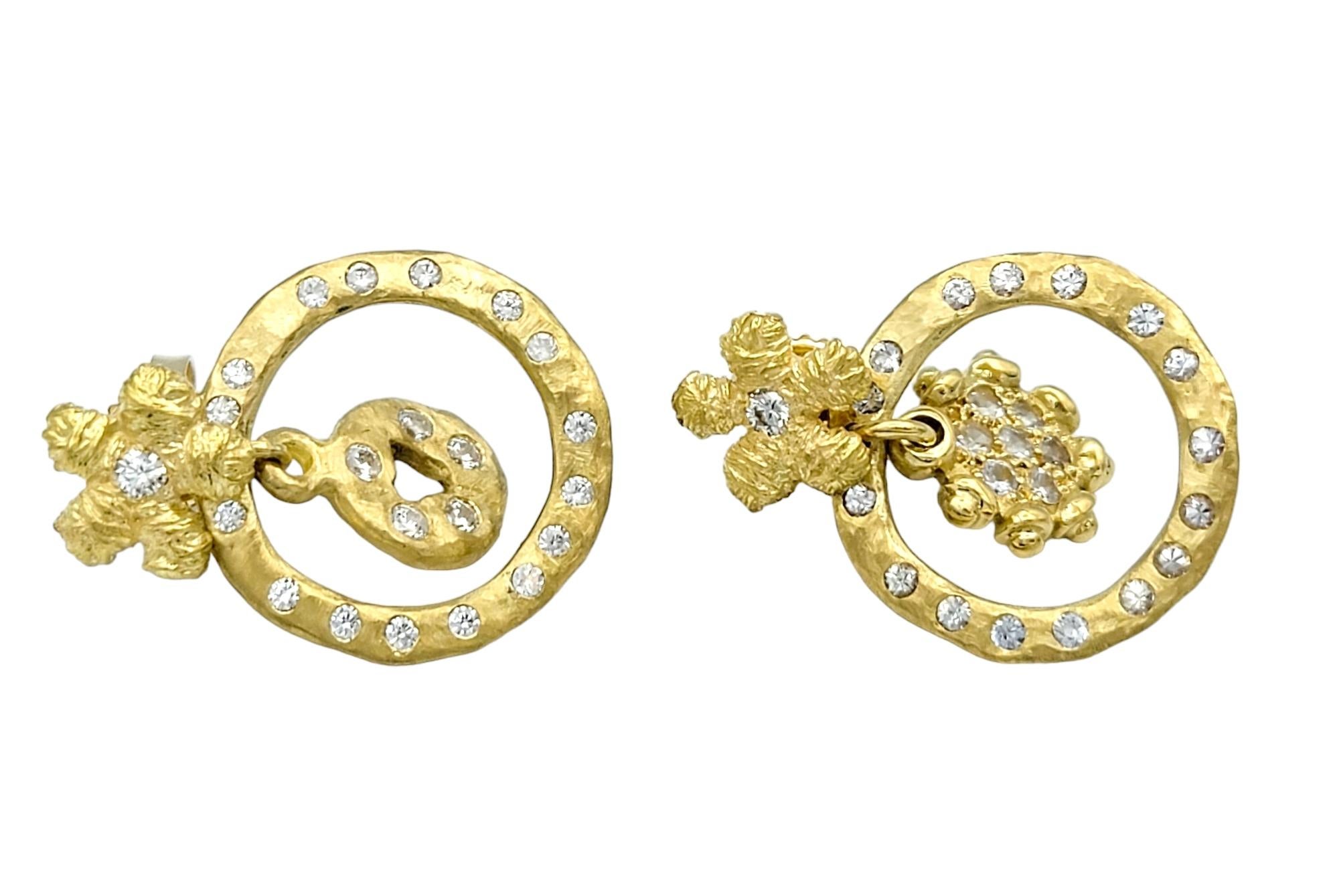 This exquisite pair of earrings, crafted in luxurious 18 karat yellow gold, is a beautiful and unique set of fine jewelry. The hammered finish provides an organic, tactile quality, adding a unique texture and shape that sets them apart. The design