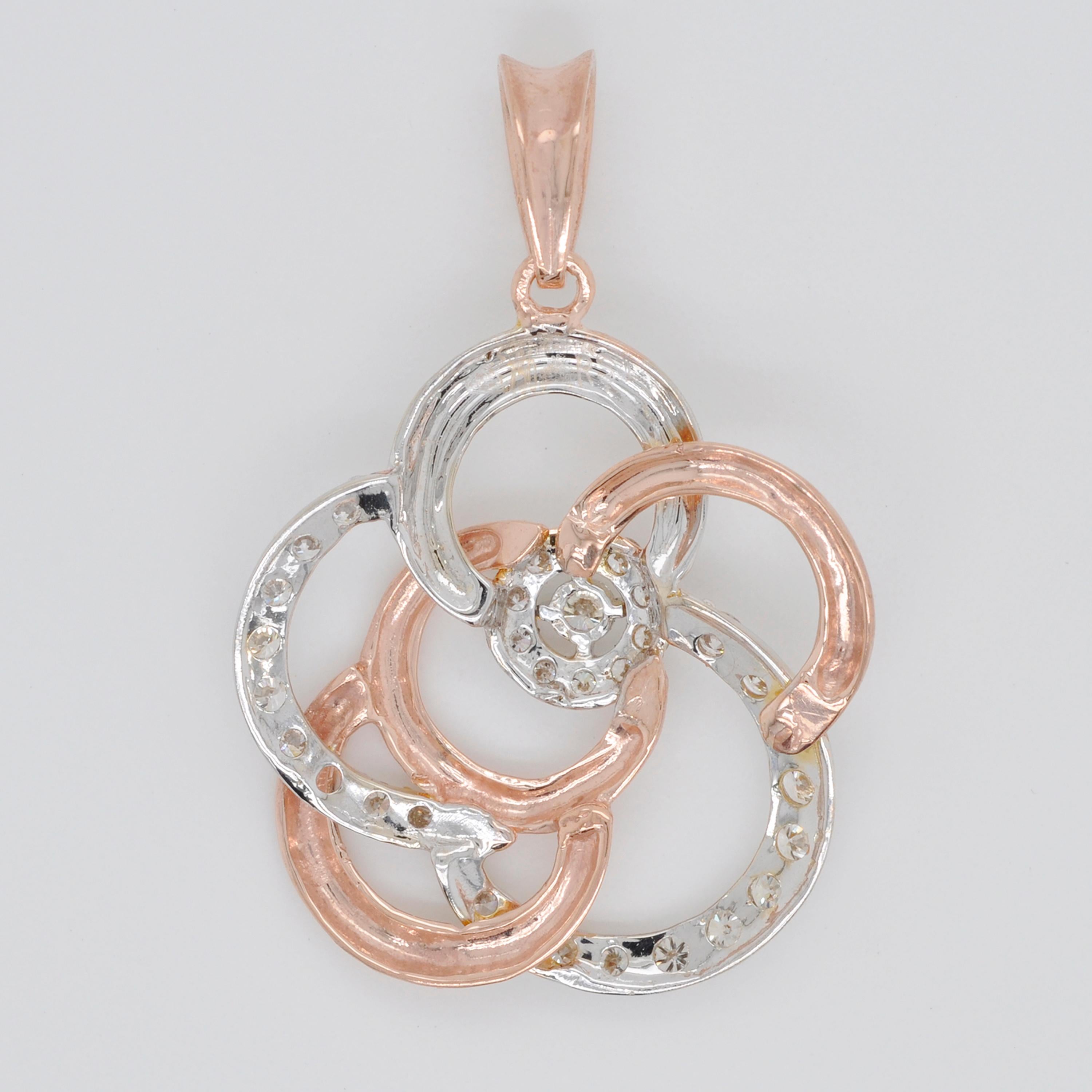 This beautiful 18 karat gold diamond pendant necklace is extremely elegant. Coupled with rose gold and white gold, the pendant is inspired by the shape of a rose. Wear it everyday, this piece of jewel is never a bore. 

Details:
Gold wt: 3.084 g
Dia