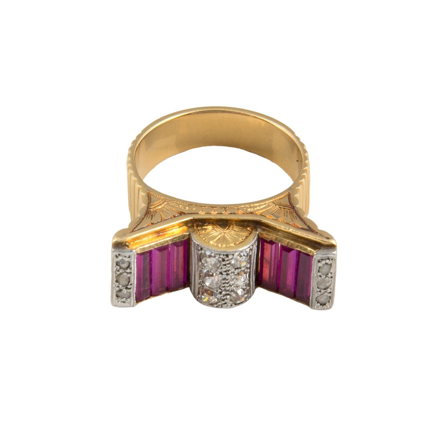 Retro ring in 18 Karat white gold-topped yellow gold, set with 0.18 carats in diamonds and red stones.
Size: Swiss 15, French 55, US 7¼, UK O