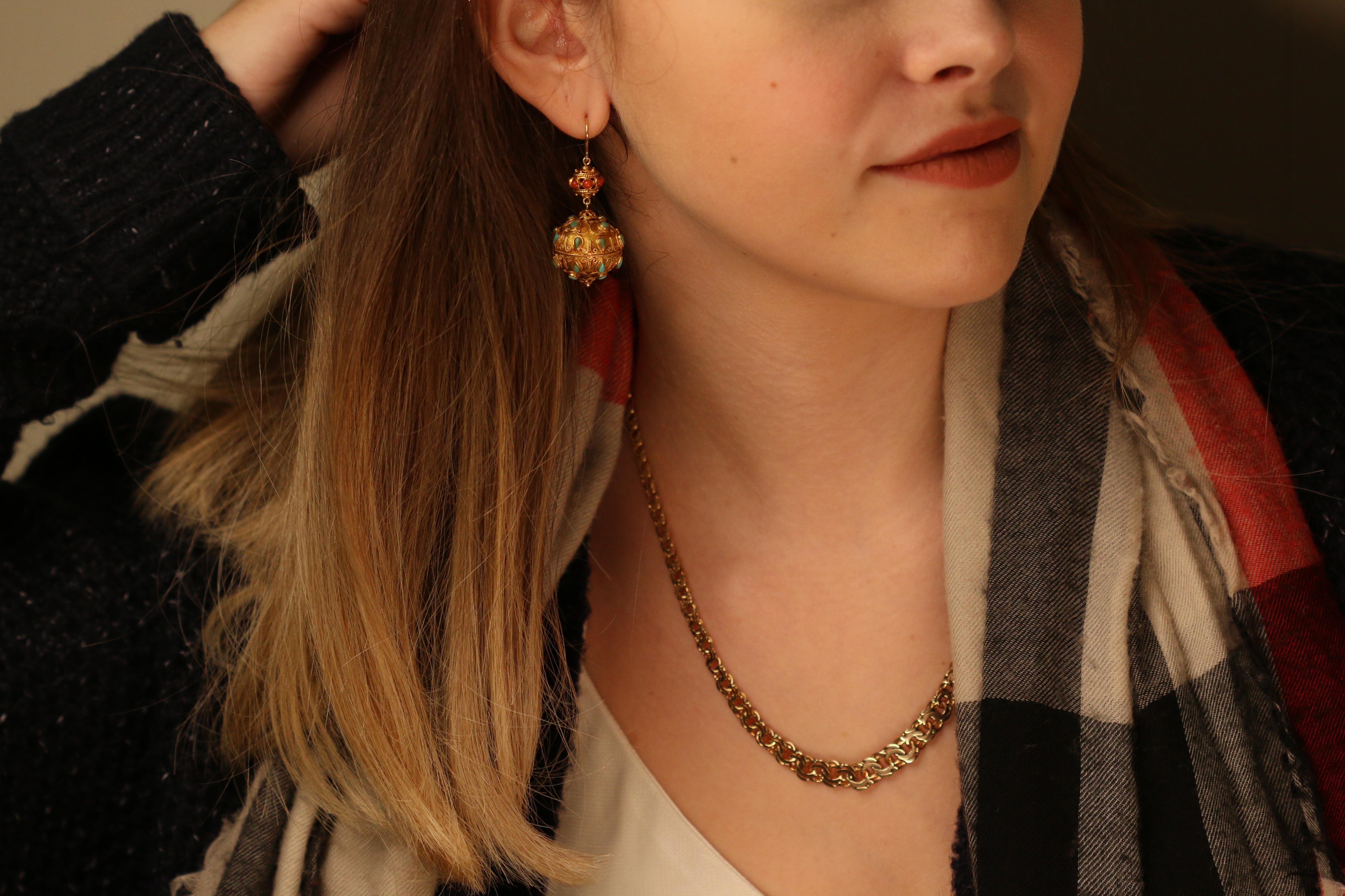 These earrings take you back to ancient Chinese times. Due to the overall shapes, style, and feeling. Embellished with beads of rich red coral, unforgettable sky turquoise. Set in delicious 18 karat gold.

Certainly the more you look at them, the