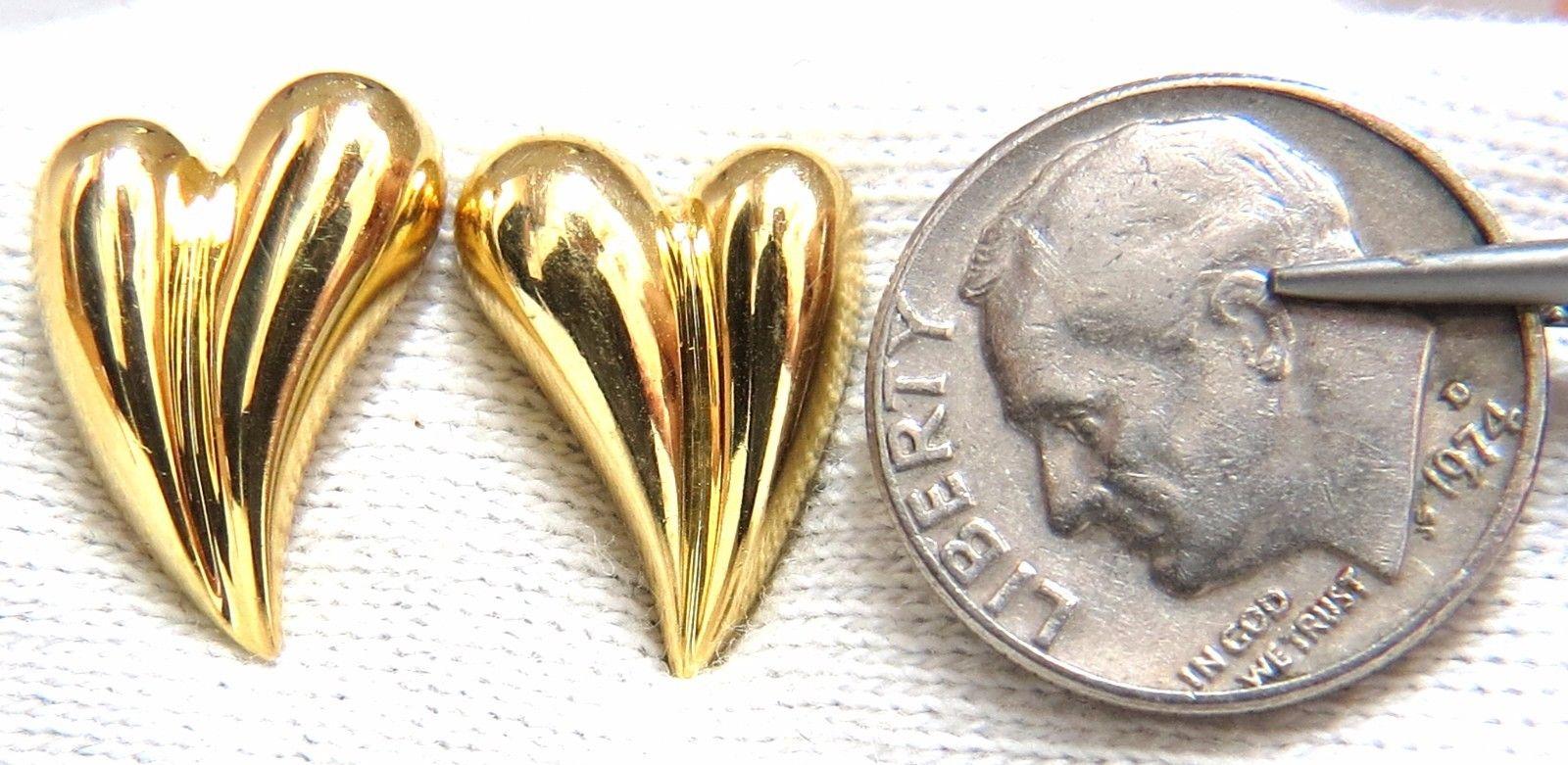 Elongated Heart Earrings

Measurements of Earrings:

15.4 x 11.7mm

Comfortable Butterfly Pushbacks

5.8 grams / 18kt. Yellow Gold

Earrings are gorgeous made