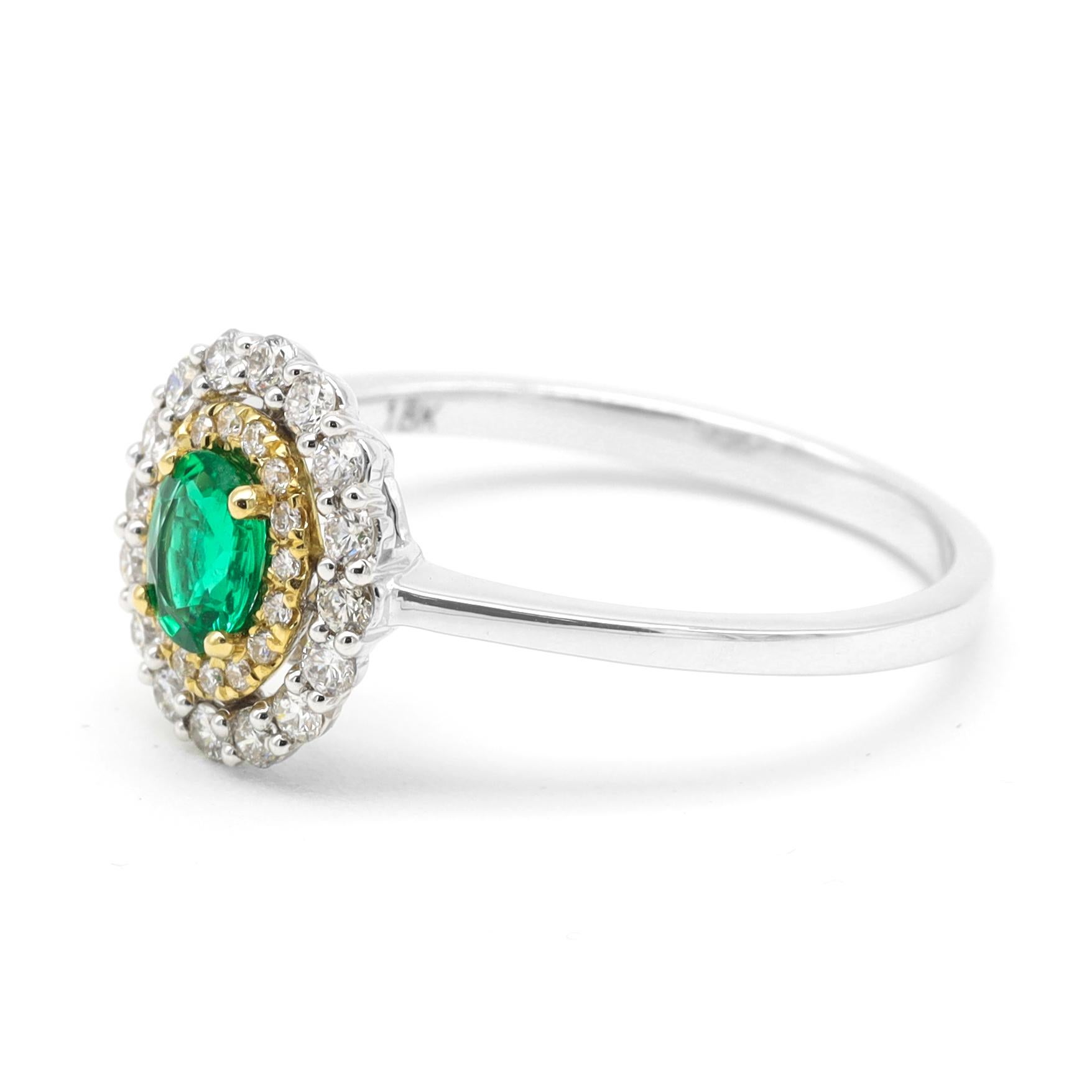 18 Karat Gold Natural Emerald and Diamond Double Cluster Ring

This illuminating spring green oval emerald and double cluster diamond ring is keenly gratifying. The sublimely placed rich green emerald oval solitaire in the center in yellow gold
