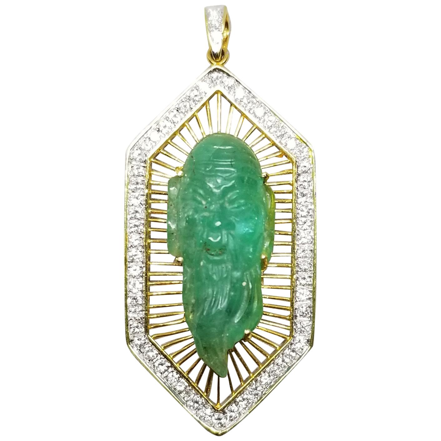 18 Karat Gold Emerald and Diamond Pendant Containing 1 Hand Carved Emerald For Sale