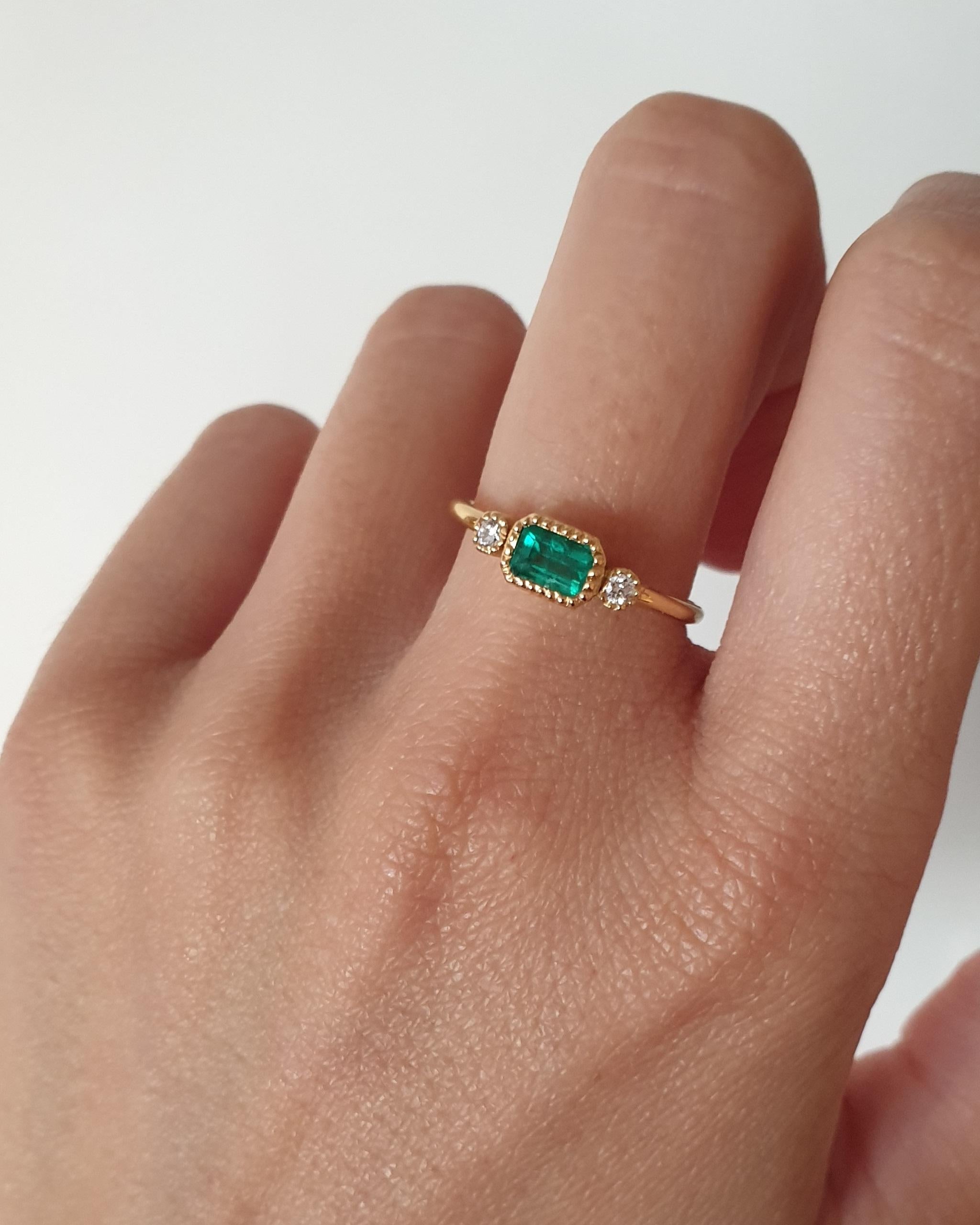 Emerald and brilliant cut diamond ring.
Handmade ring mounted in 18k gold.
Ring size 12, but can be resized.