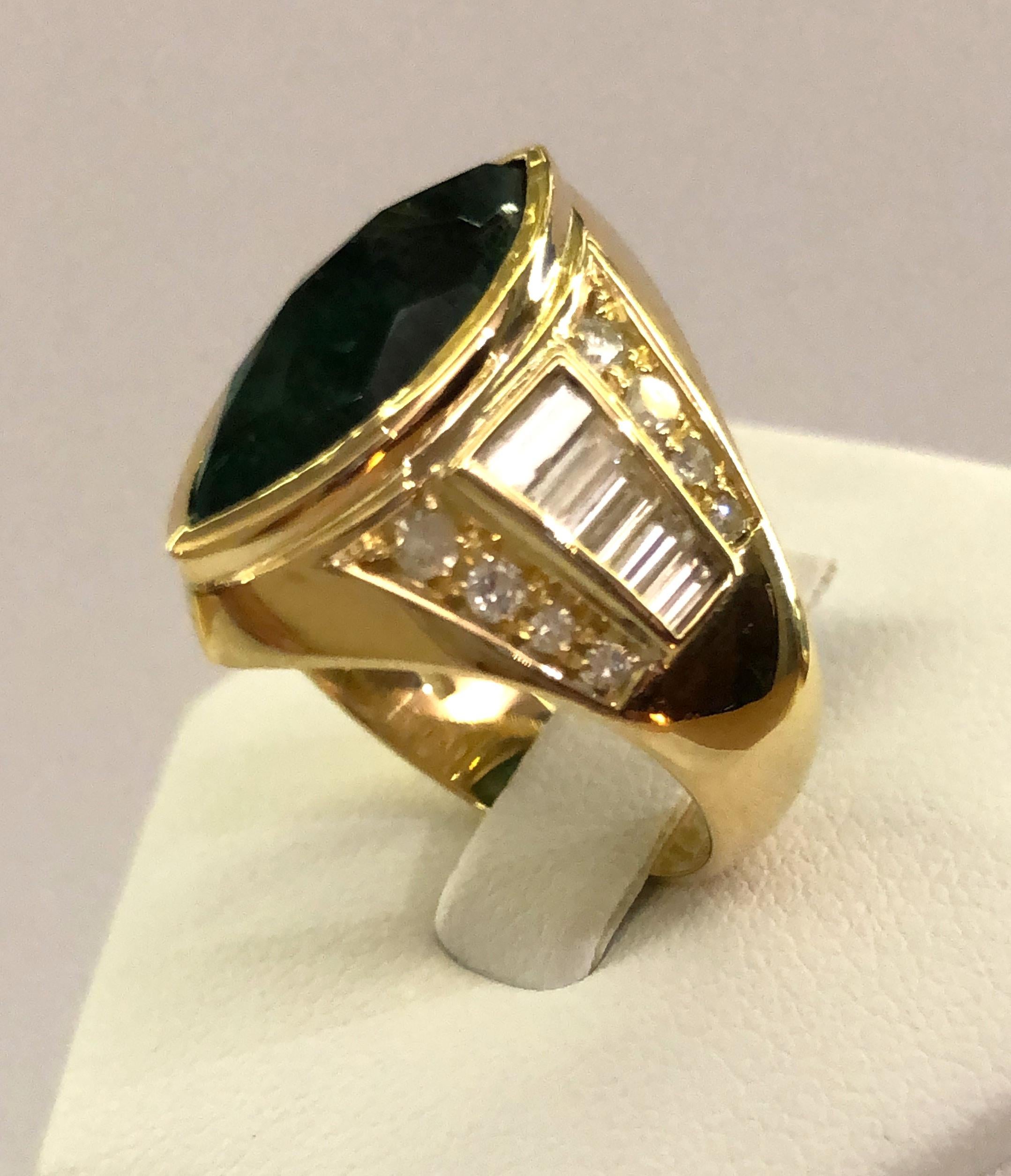 Vintage 18 karat gold ring, with a large diamond shaped emerald in the center, and brilliant diamonds on the stem for a total of 1.2 karats, Italy 1950-1970s
Ring size US 6.5