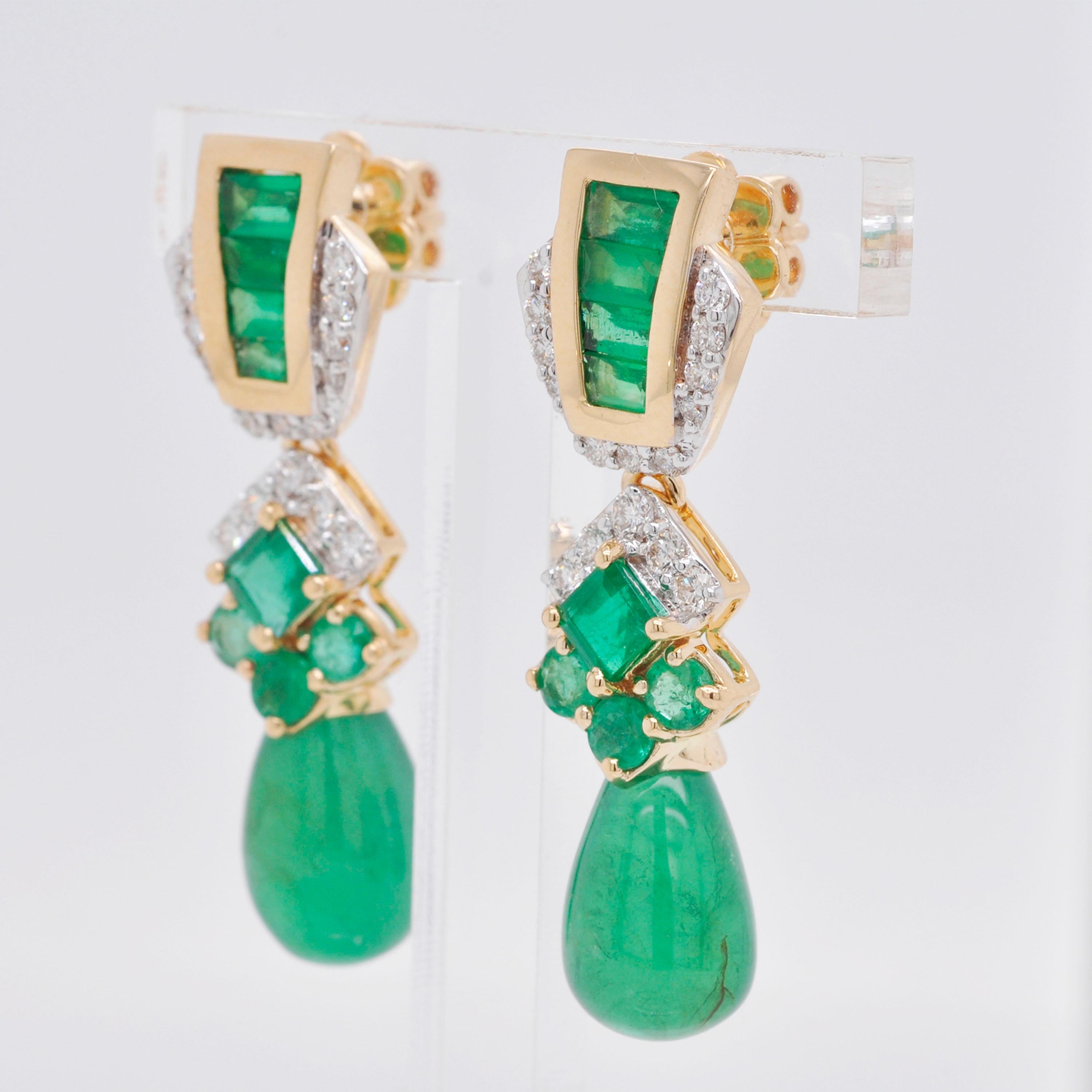 18 karat gold emerald baguette emerald drop diamond dangler earrings.

This adorable and glamorous parakeet green emerald and drop earring is splendid. The formation of baguettes, squares, rounds and drop emeralds and diamonds in the side pave