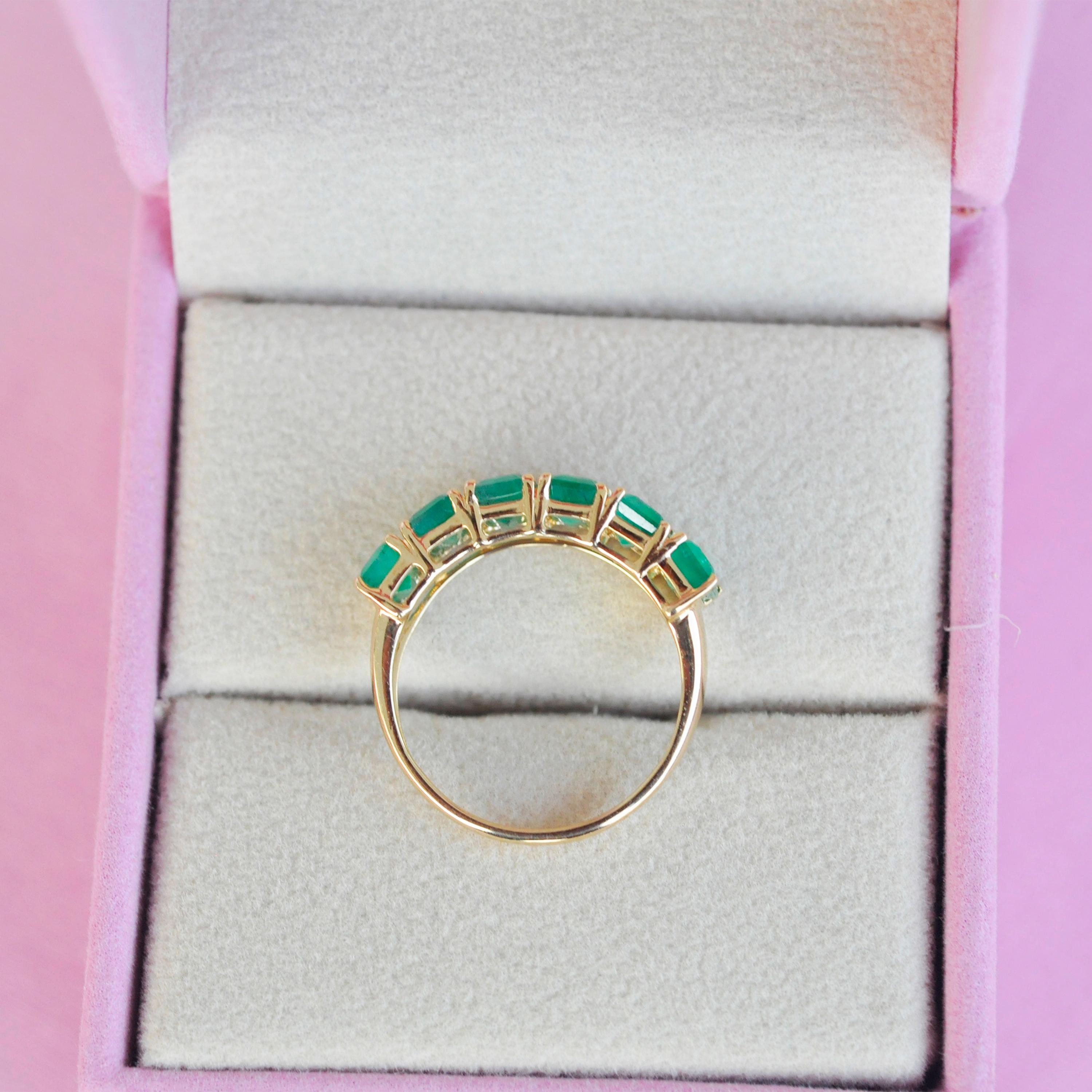 For Sale:  18 Karat Gold Emerald Cut Octagon Brazilian Emerald Half Eternity Band Ring 10
