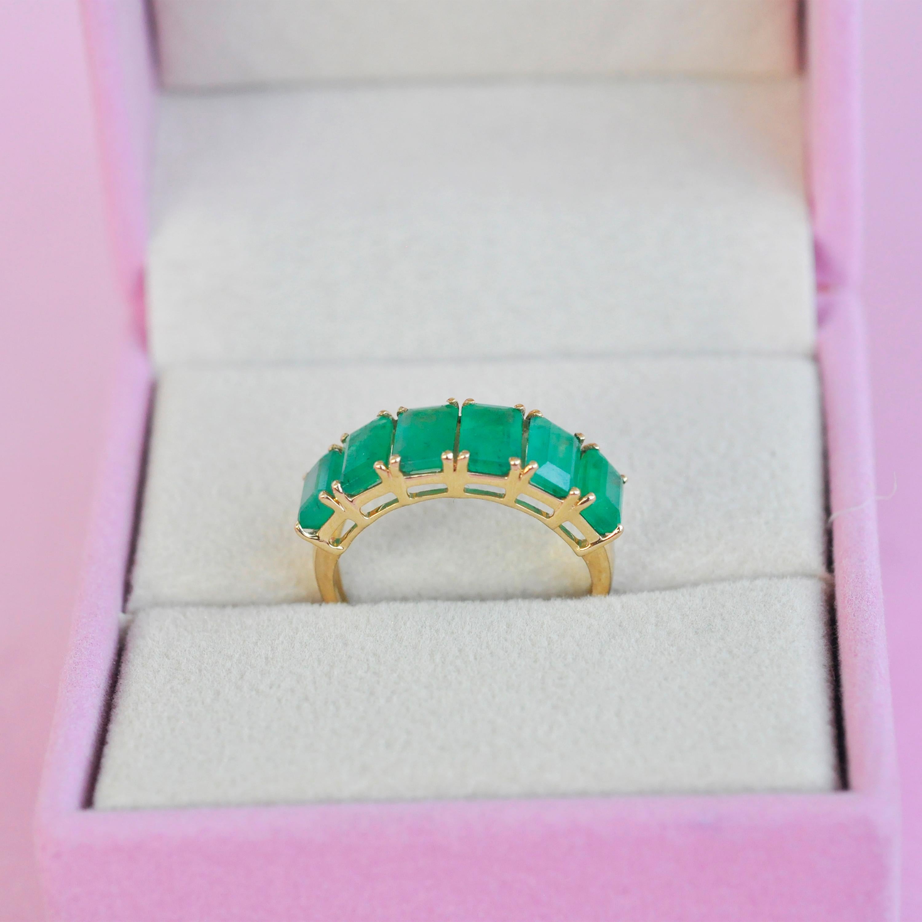 For Sale:  18 Karat Gold Emerald Cut Octagon Brazilian Emerald Half Eternity Band Ring 11