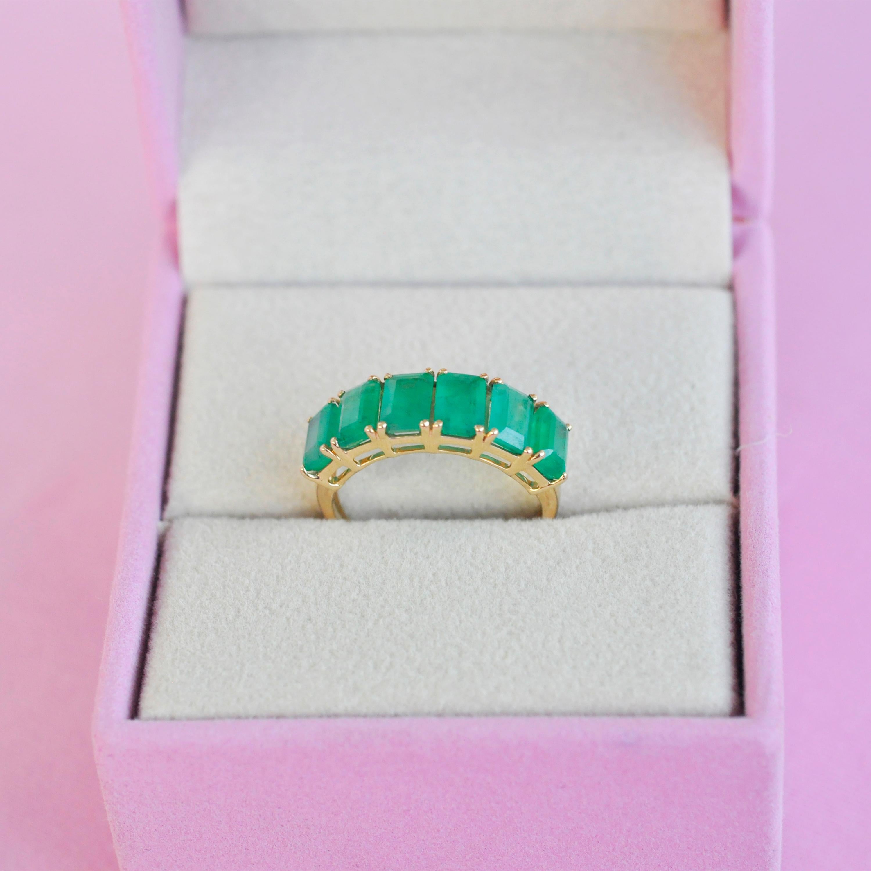 For Sale:  18 Karat Gold Emerald Cut Octagon Brazilian Emerald Half Eternity Band Ring 12