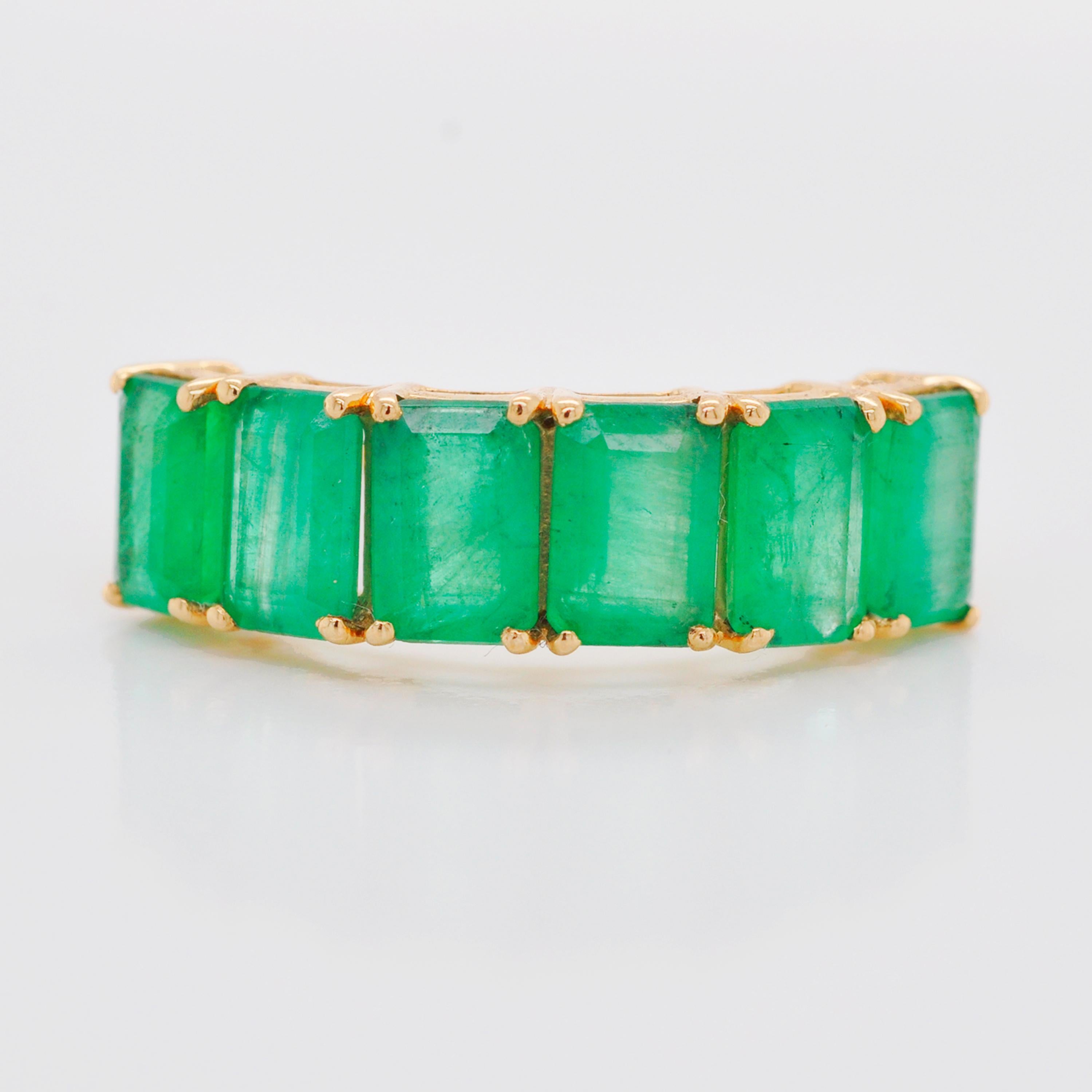 For Sale:  18 Karat Gold Emerald Cut Octagon Brazilian Emerald Half Eternity Band Ring 5