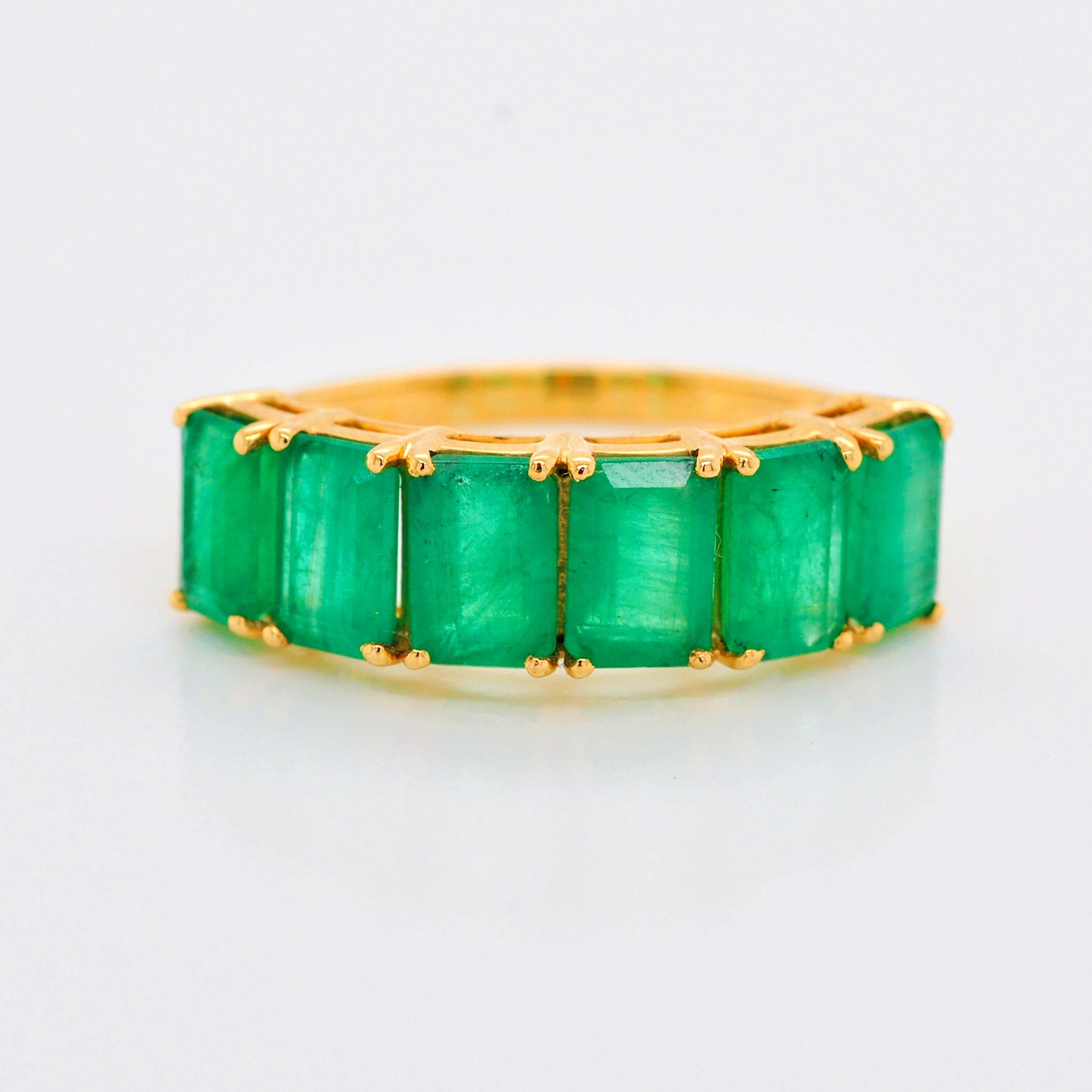 For Sale:  18 Karat Gold Emerald Cut Octagon Brazilian Emerald Half Eternity Band Ring 6