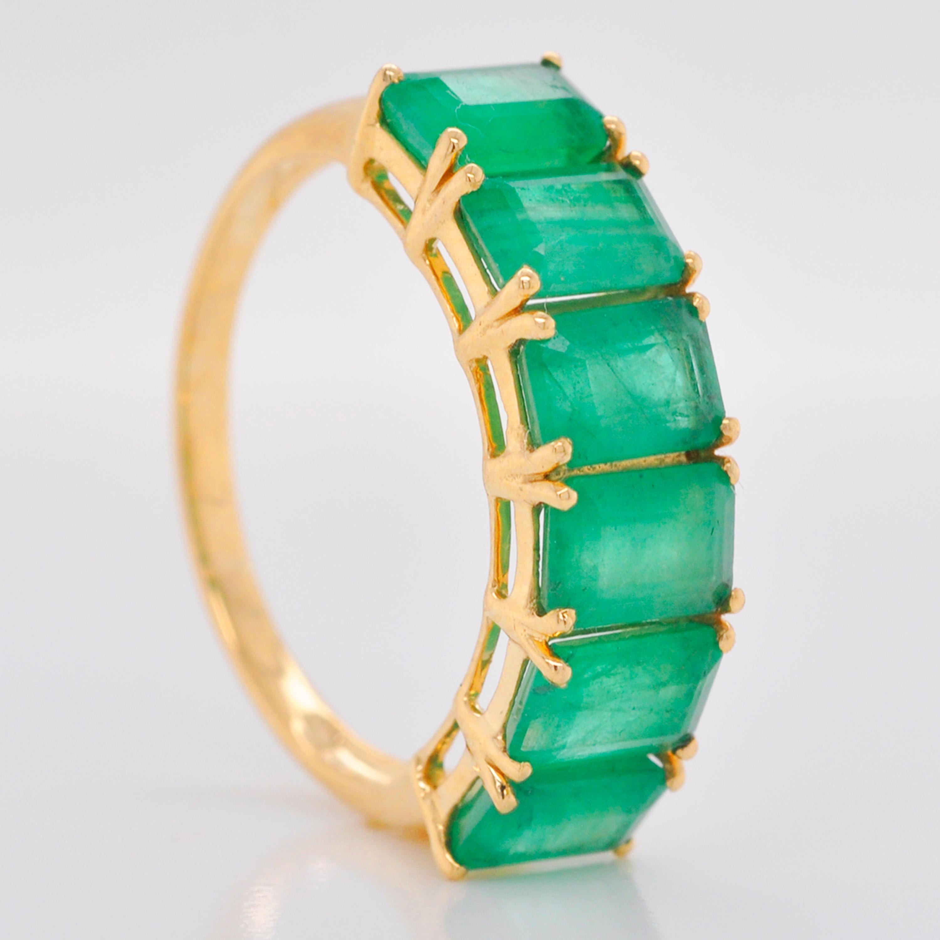 For Sale:  18 Karat Gold Emerald Cut Octagon Brazilian Emerald Half Eternity Band Ring 8