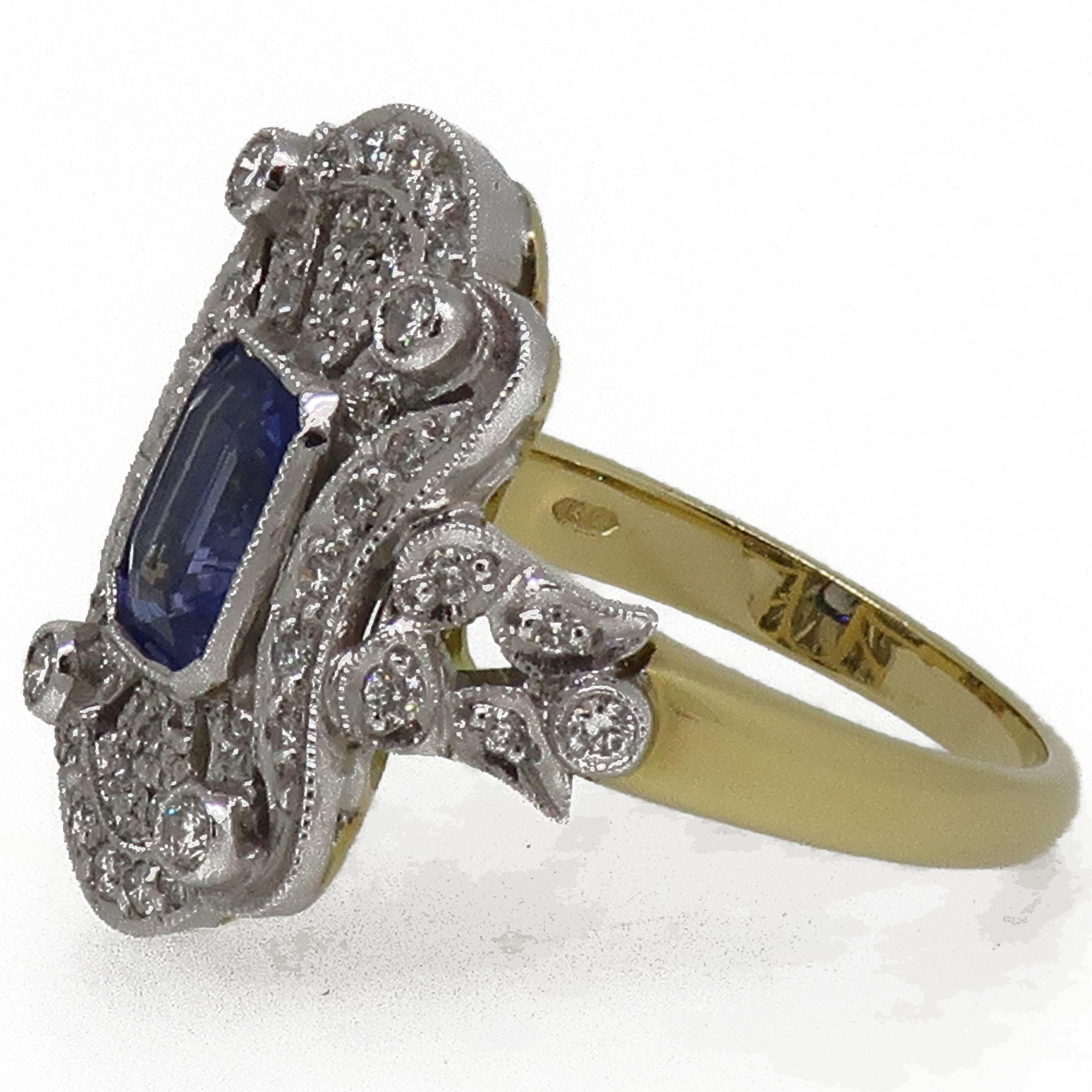 18 Karat Gold Emerald Cut Sapphire & Diamond Art Deco Style Cluster Ring

A stand out elaborate blue emerald cut sapphire ring, sapphire weighing 1.50ct. This ring consists of central blue sapphire with an elaborate design of small white brilliant