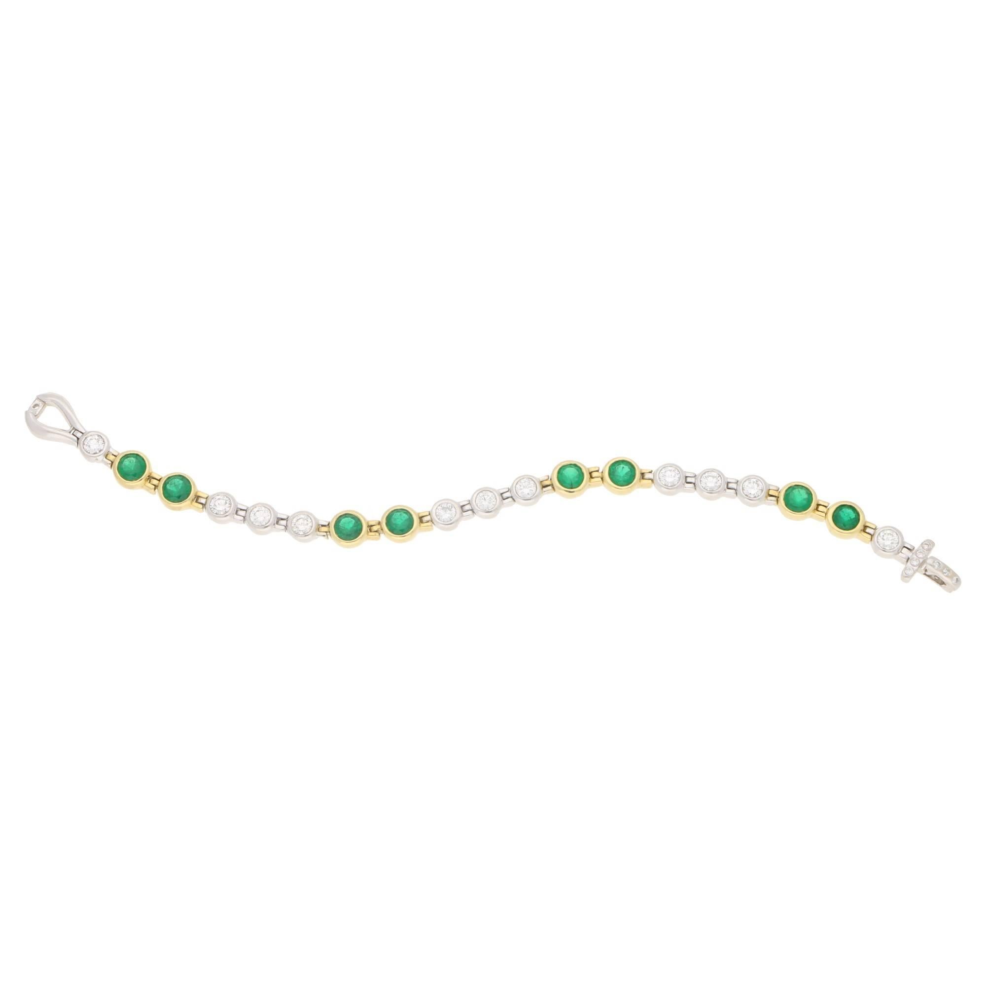 Estimated total diamond weight: 3.63 carats, estimated total emerald weight: 3.52 carats.
A stylish vintage emerald and diamond line bracelet. 
The rub-over set bracelet is formed of eleven round brilliant cut diamonds set into 18 carat white gold