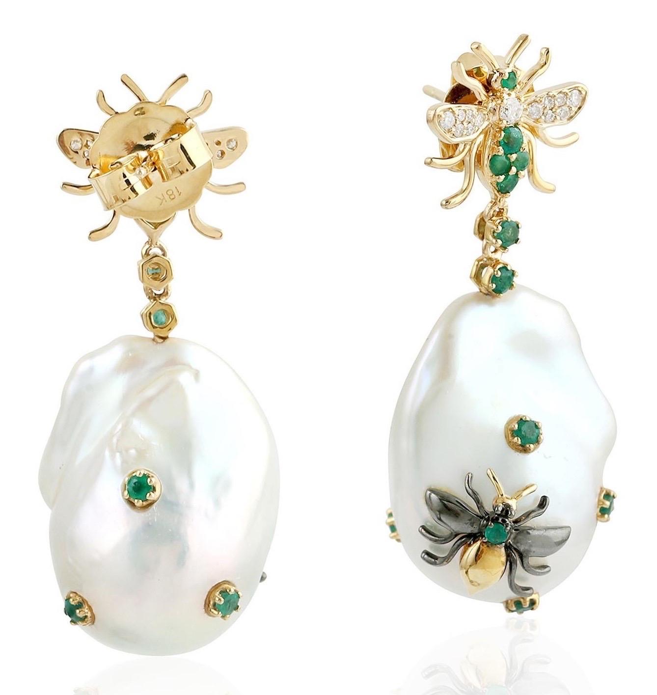 These pearl earrings are thoughtfully and meticulously crafted with   
18 Karat yellow gold.  It is set with 71.6 carats pearl, .77 carats emerald and .23 carats of diamonds.

FOLLOW  MEGHNA JEWELS storefront to view the latest collection &