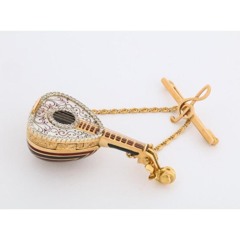 An Italian 18 karat gold, enamel, and diamond mandolin pendant watch brooch box, by G. Ferrero,  Gorgeous quality brooch, in the form of a musical mandolin with hidden watch. Finley enameled and set with diamonds.   Measures: 0.5