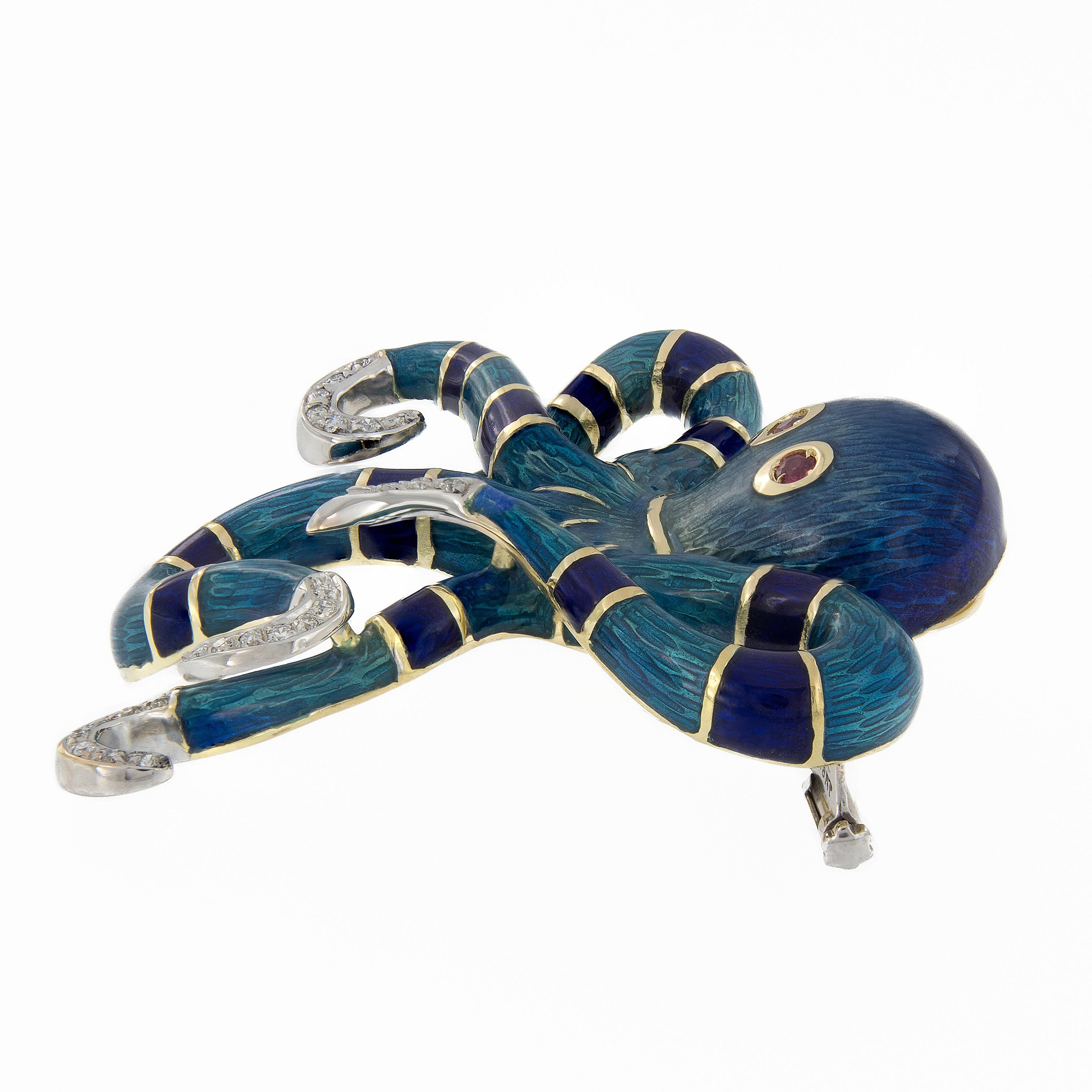 Cute, quirky and beautifully crafted in 18K yellow and white gold. The octopus brooche features royal blue and teal guilloche enamel, diamond accents and ruby eyes. Octopus measures 1.77 x 2.25 inches. Weighs 29.3 grams.

Diamonds 0.18 cttw
Rubies