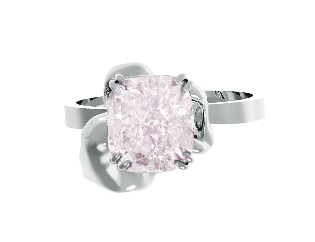 This contemporary Buttercup engagement ring is crafted in 18 karat white gold and features a GIA certified 0.6 carat light pink diamond in cushion cut, which is natural and unheated with dimensions of 4.59x4.53x3.2 mm, and SI2 clarity.

The delicate