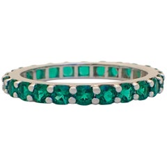18 Karat Gold Eternity Band with Chatham-Created Emeralds Weighing 1.22 Carat