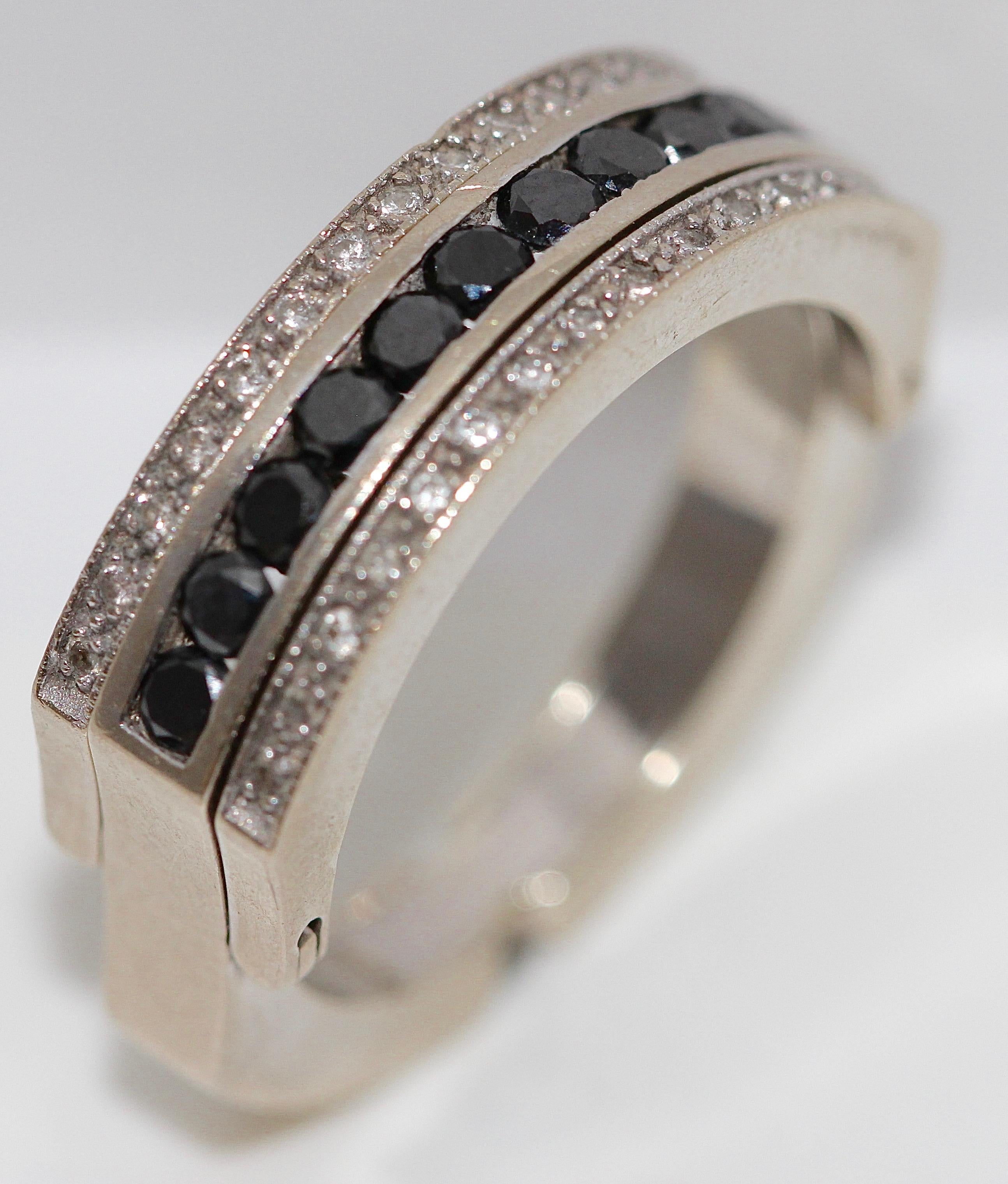Elegant and very fashionable 18k White Gold Eternity, Transformation, memory ring with black and white diamonds.

Inner Diameter 19mm.
