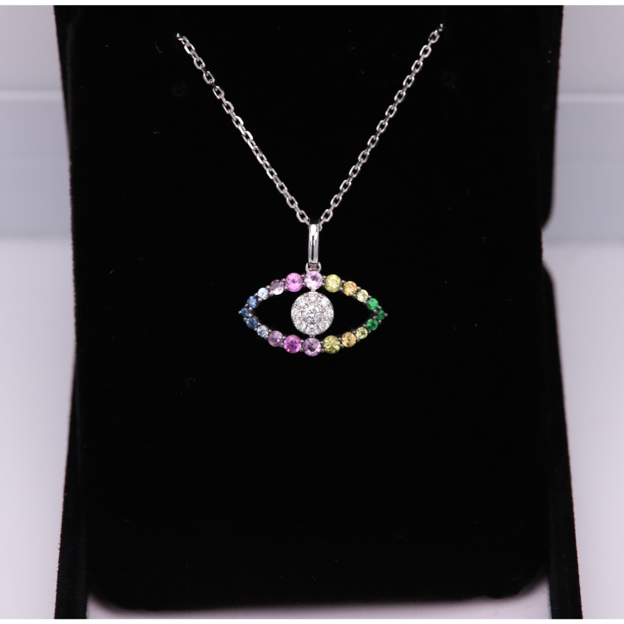 Evil Eye- Eye catching - Good Luck - In real colors and Diamonds
Brilliant - Amazing colors of Natural gemstones.

18k White Gold Plated with Black Rhodium 3.70 grams total weight (with the chain).
Multi Colors of gems semi precious and Sapphires,