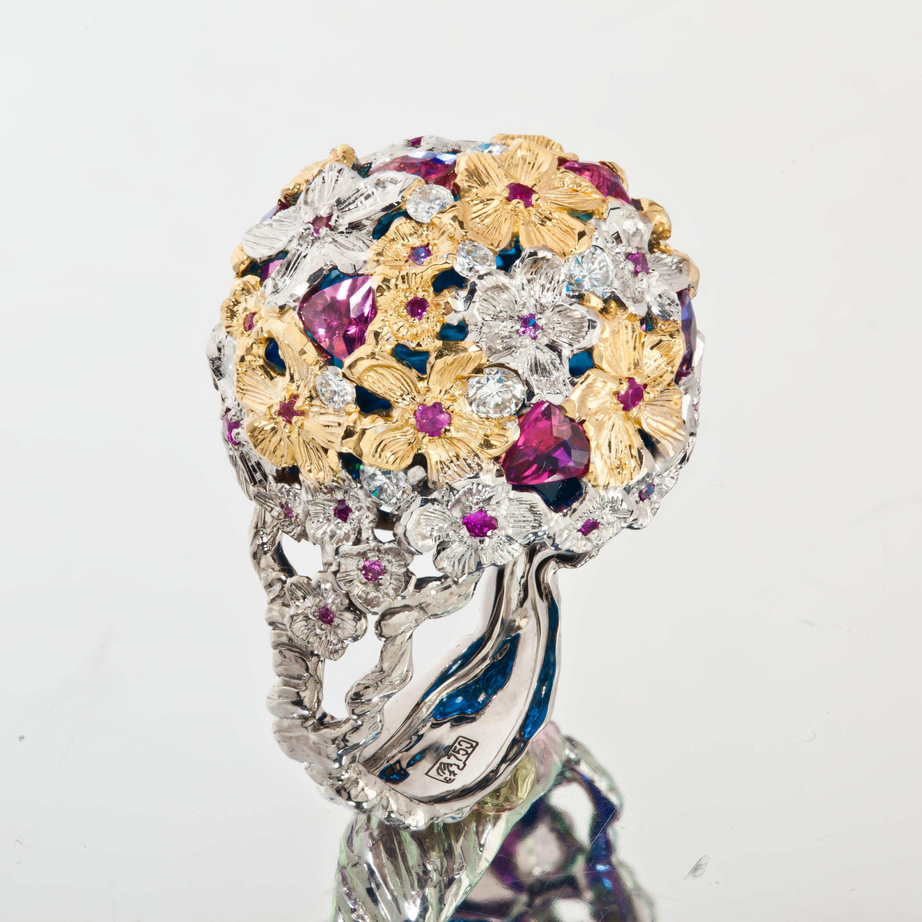 This bespoke handmade ring from Viktor Moisiekin seamlessly intertwines the magic of a blossoming tree with the temptation of delicious fruits and vibrant flowers. Golden flower petal claws delicately embrace the luxurious fusion of diamonds,