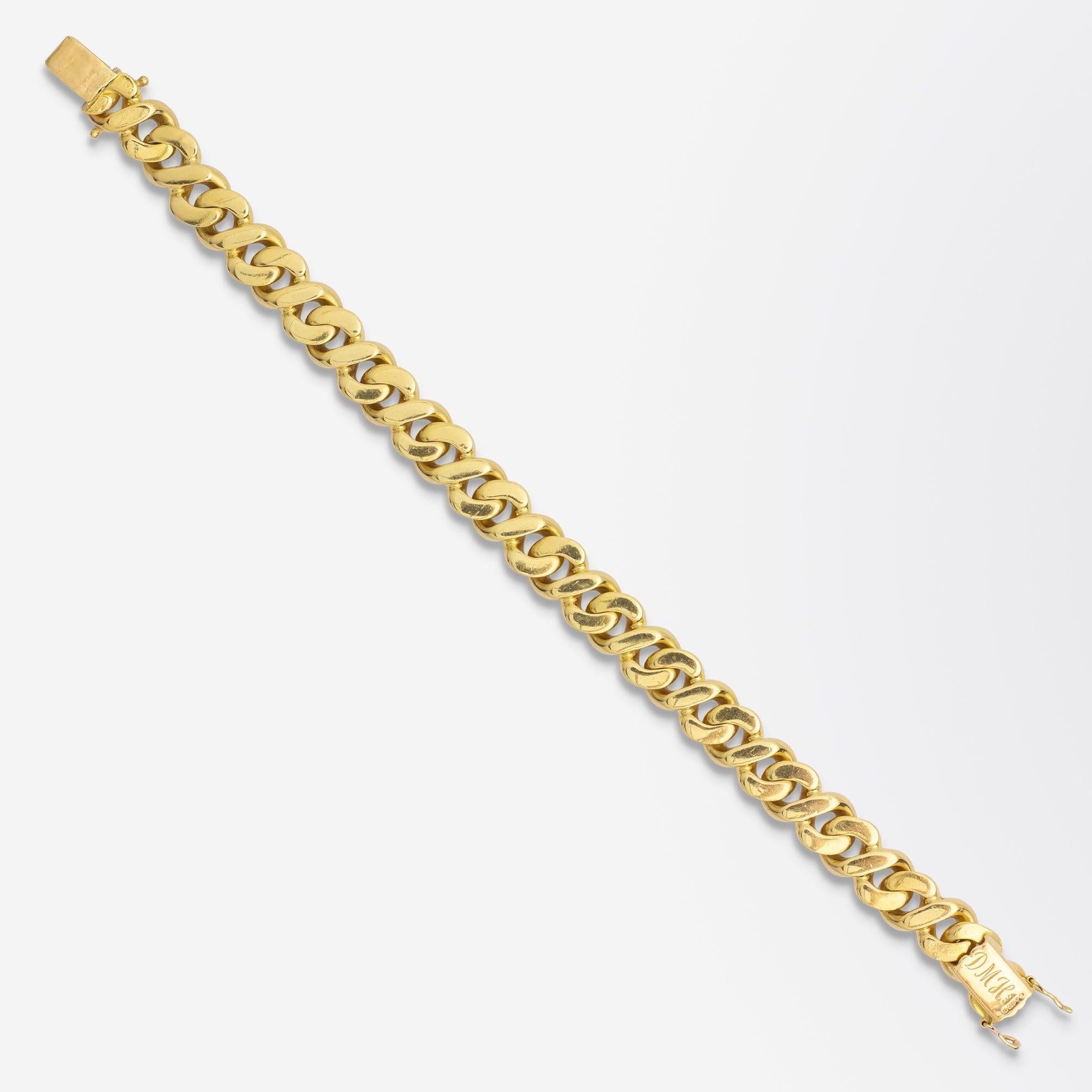 A substantial gold bracelet in 18 karat yellow gold crafted by Garrard of London. The figure of 8 link piece has got a good weight and features a tongue and box clasp with two separate safety catches. The bracelet contains hallmarks to the clasp for