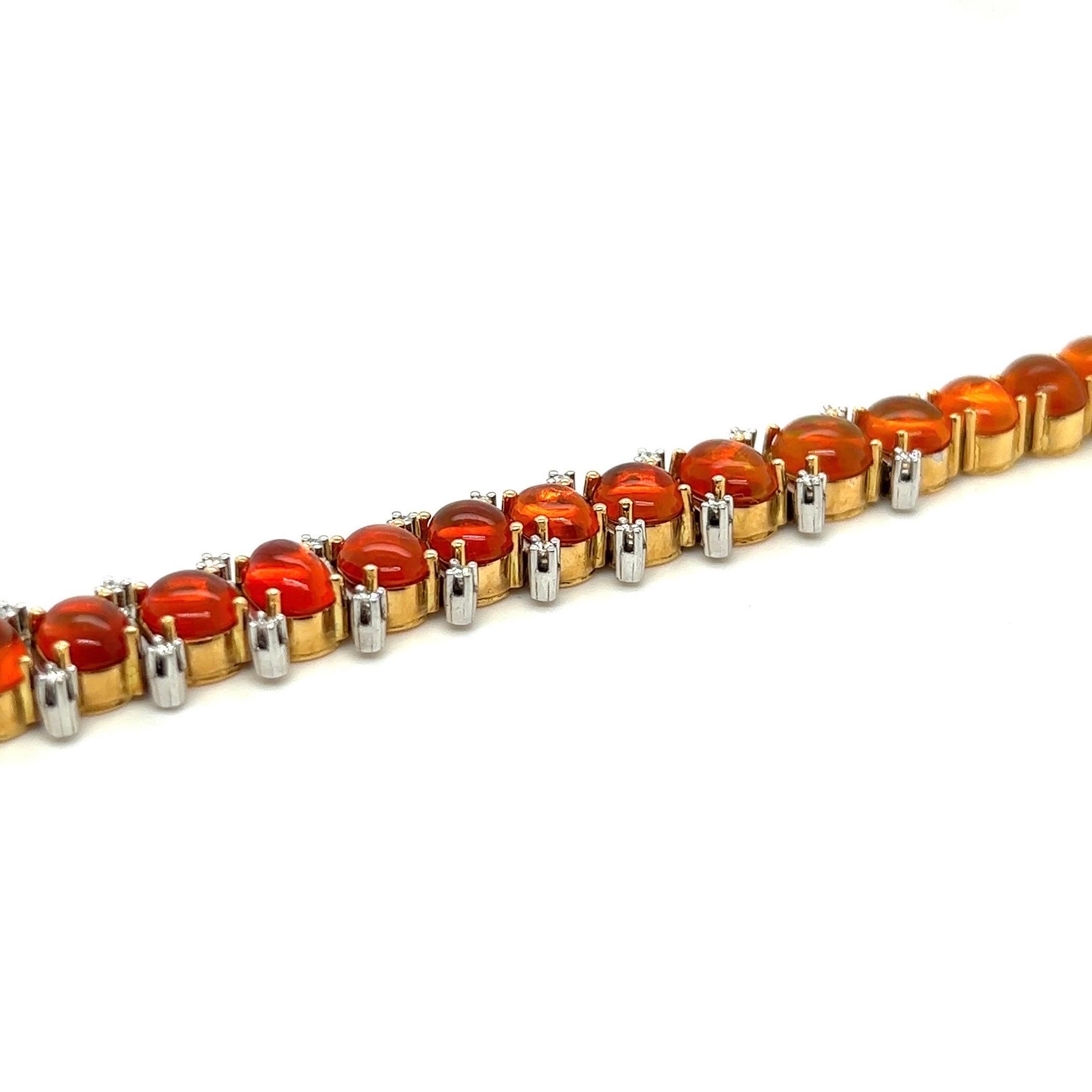 Striking 18 karat gold, fire opal and diamond rivière bracelet by Swiss jeweler Trudel, 1990s.

Crafted in 18 karat pink and white gold, set with 29 Mexican fire opal cabochons totalling 20.23 carats and accented with 28 brilliant-cut diamonds of