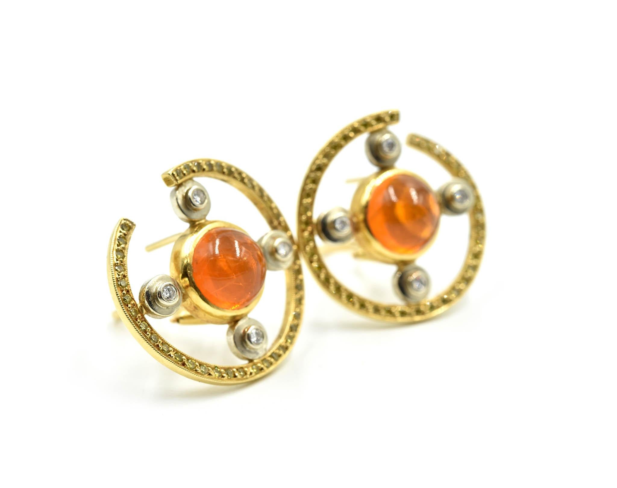 This is a pair of 18k yellow gold fire opal earrings designed with a beautiful display of white and yellow diamonds! Each fire opal measures 9.62mm in diameter. Round white diamonds are bezel set on four sides of the fire opal. The 8 diamonds weigh