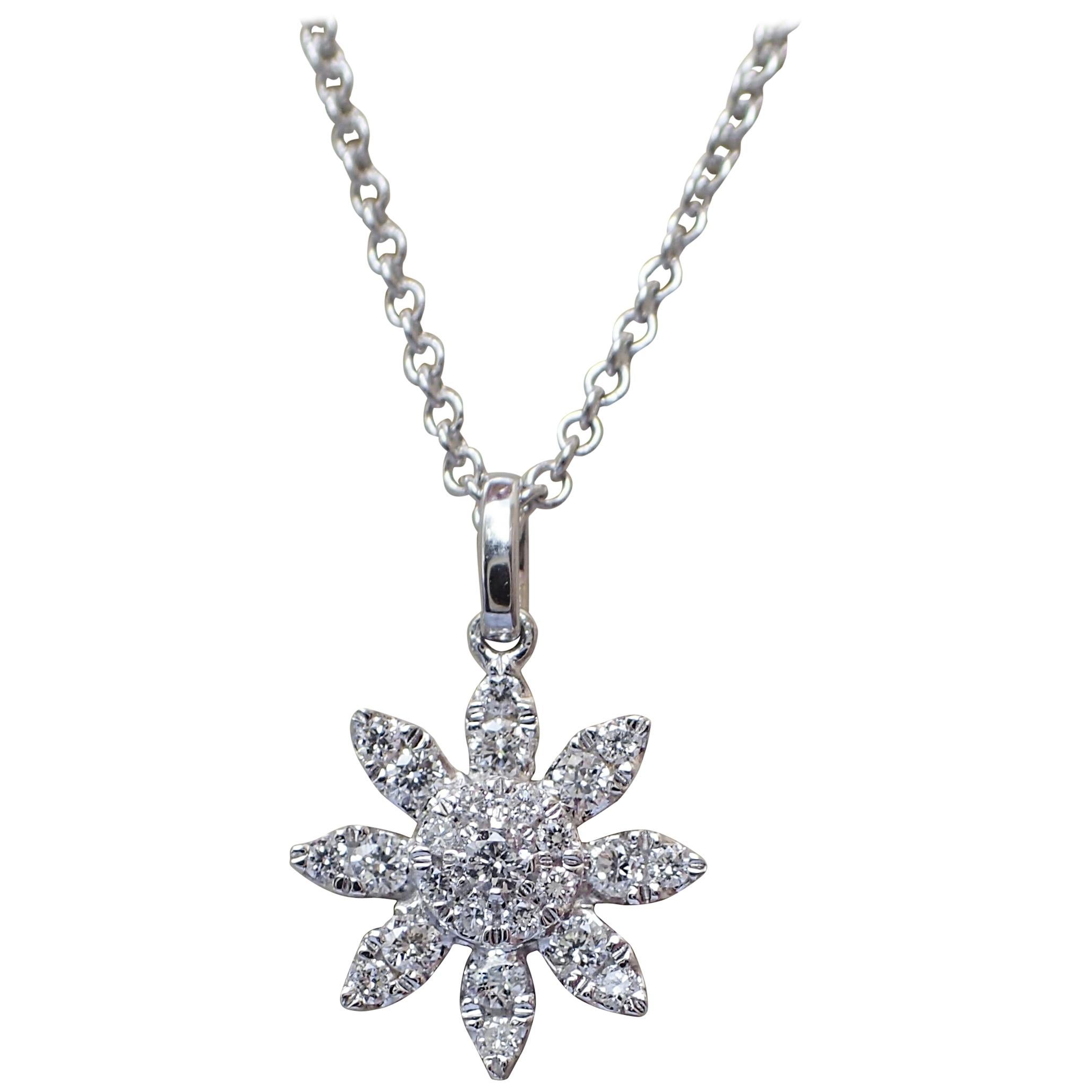 18 Karat Gold Flower Pendant with 0.24 Carat of Diamond Hangs from a Chain