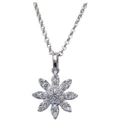 18 Karat Gold Flower Pendant with 0.24 Carat of Diamond Hangs from a Chain